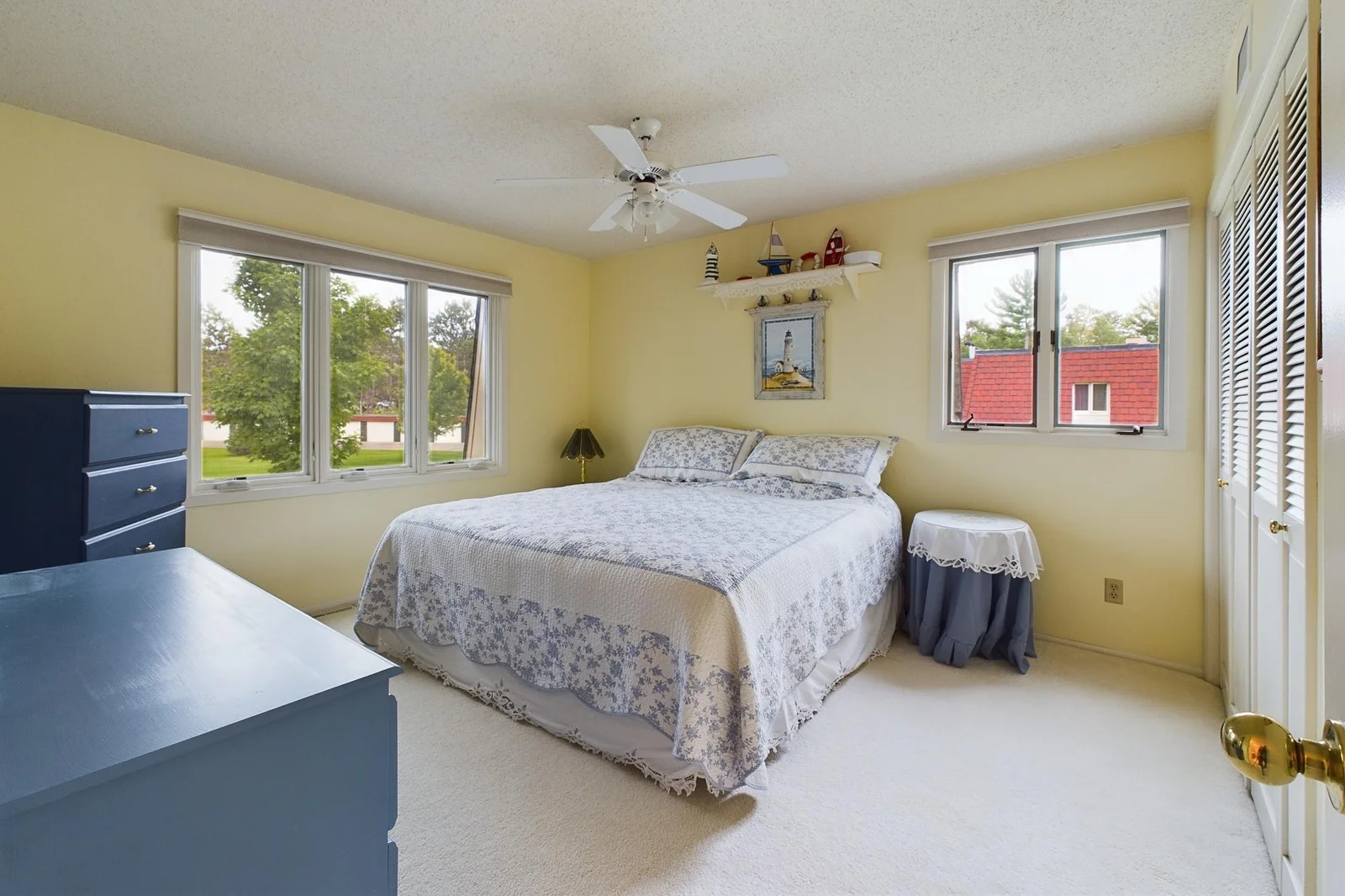 Large bedroom overlooking courtyard.
