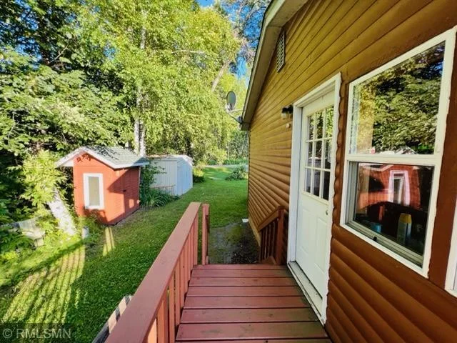 Entry looking out to shed and road