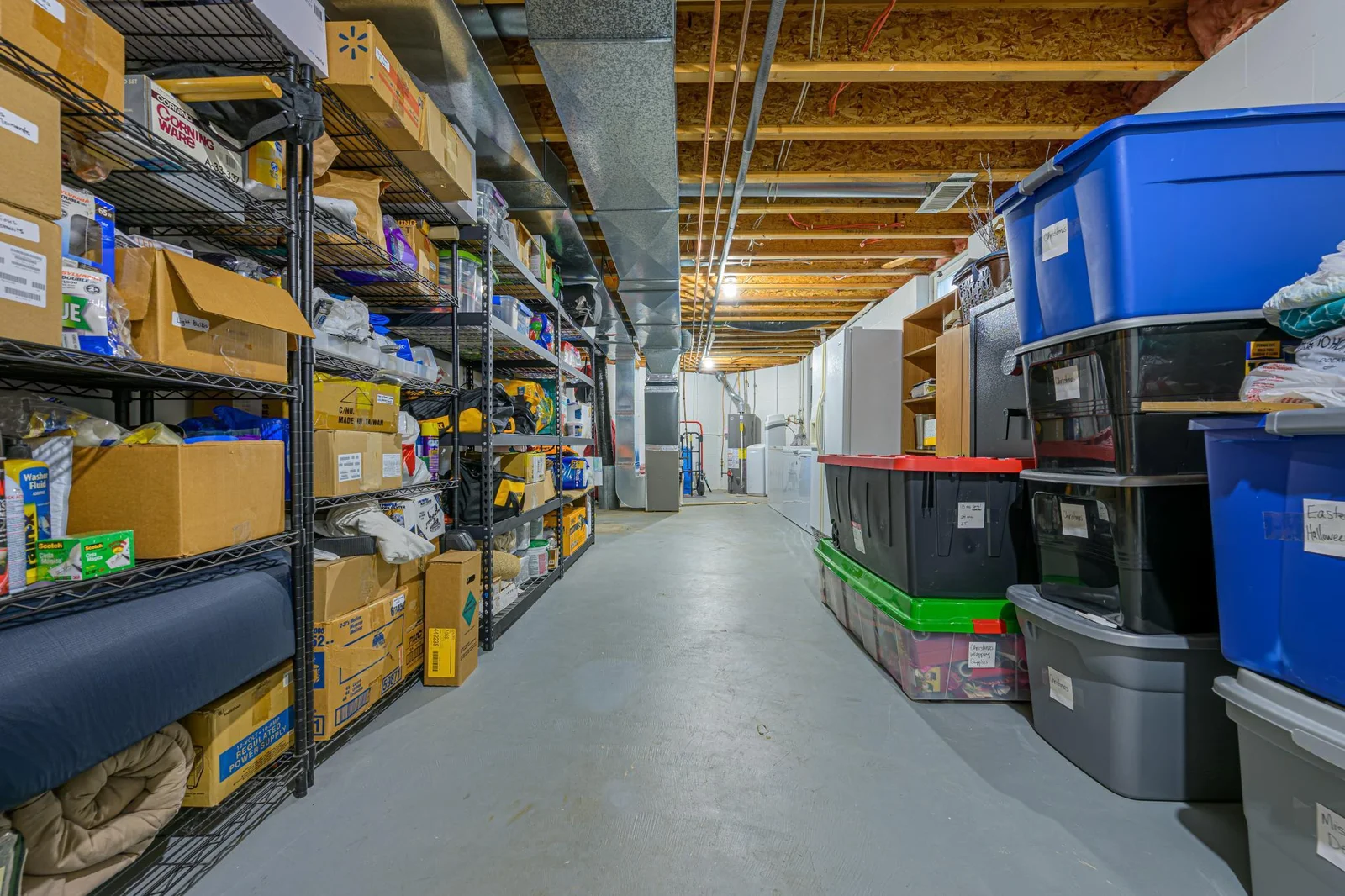 The utility room features a lot of storage. The shelving is negotiable.
