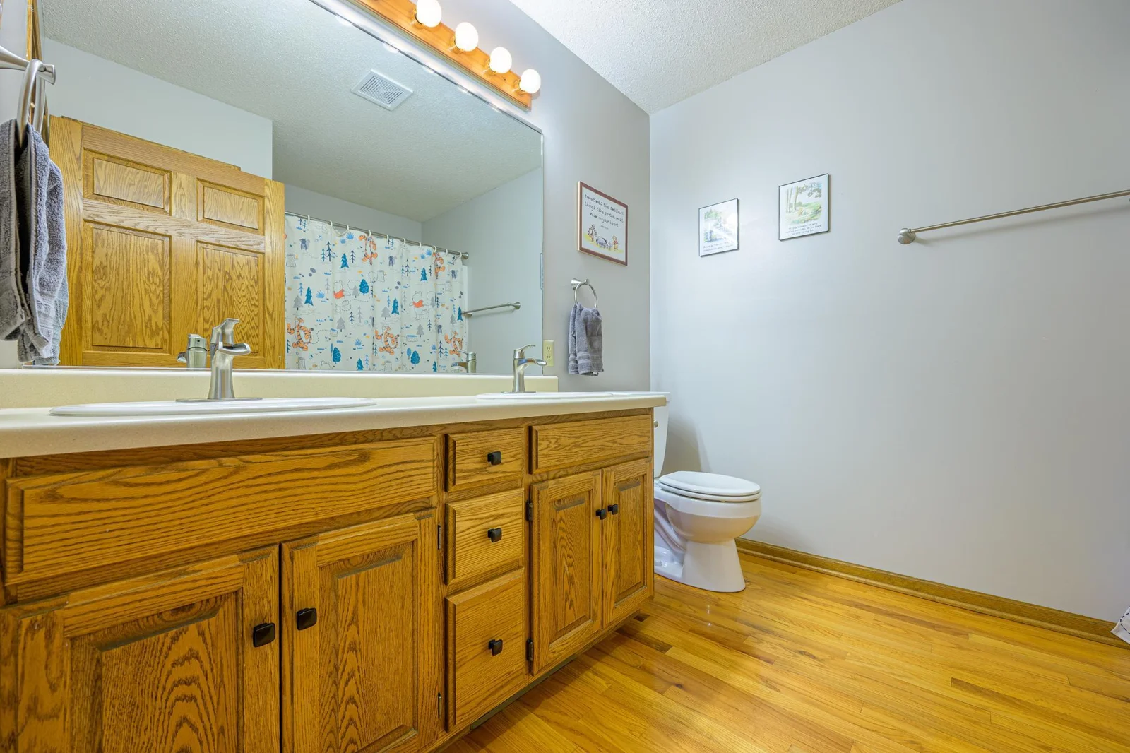 The main floor bathroom features double sinks.
