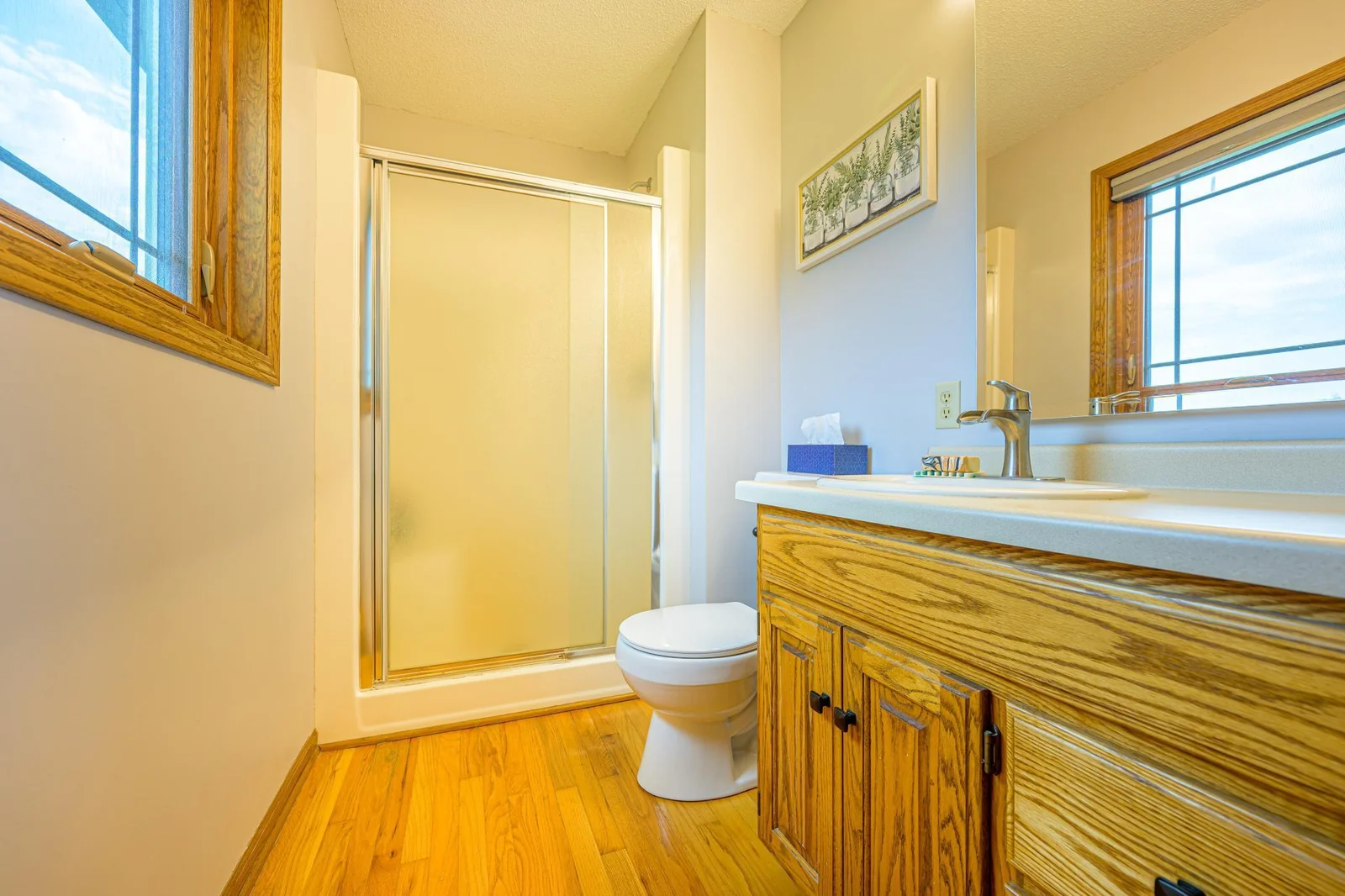 The private ensuite primary bathroom features a walk-in shower.