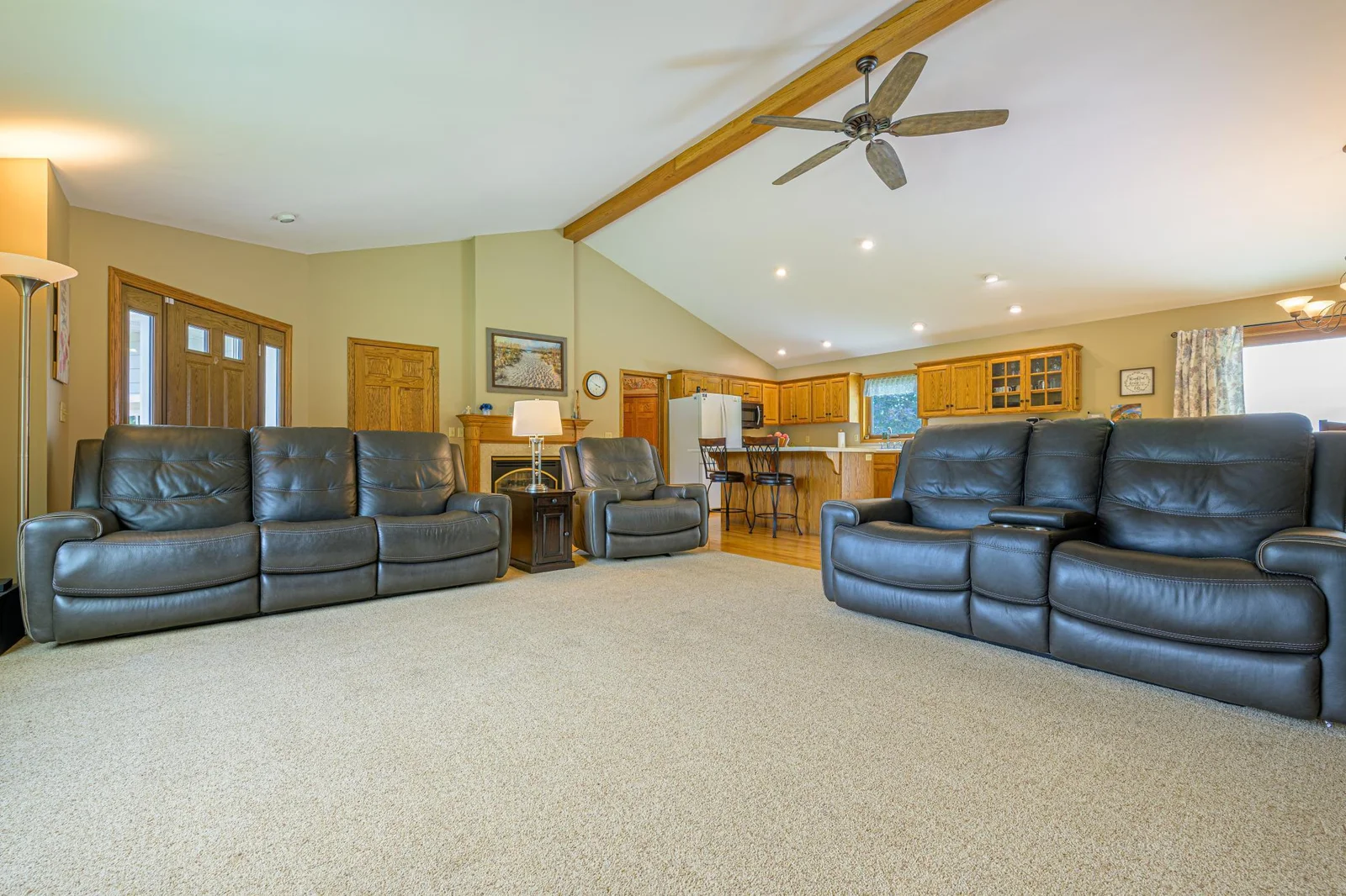 The spacious living room features vaulted ceilings,