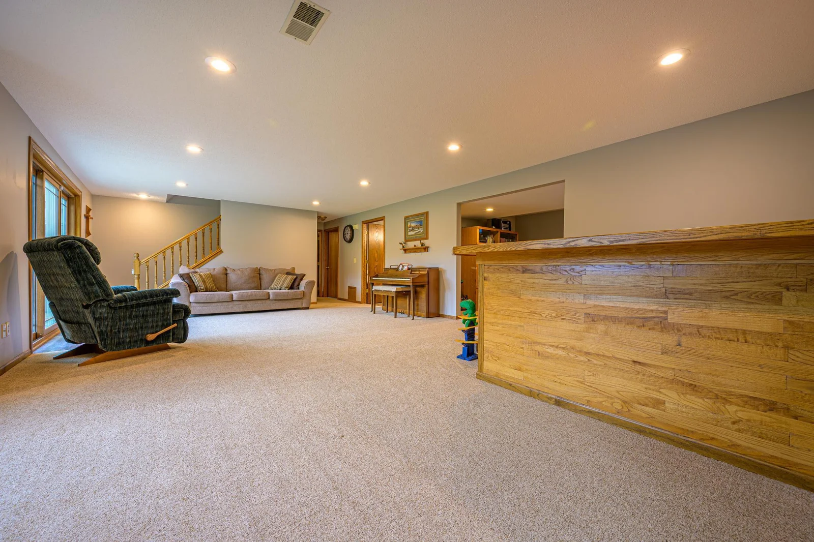 The family room features a bar that already includes water lines to set it up as a wet bar.