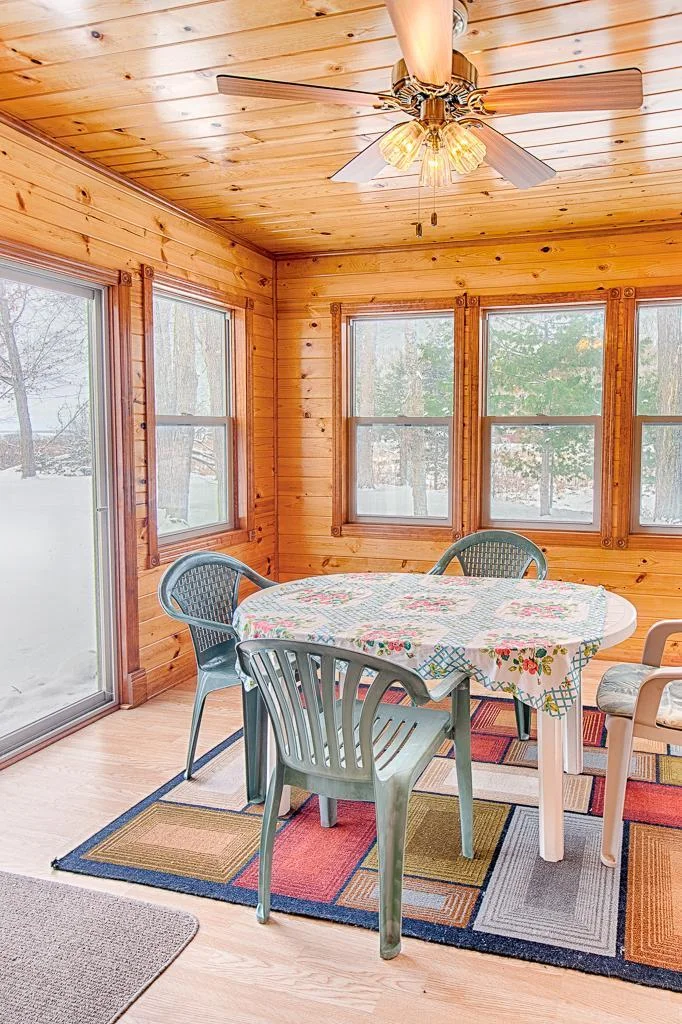 Inside view of this darling 3-season porch on creek-side of home...