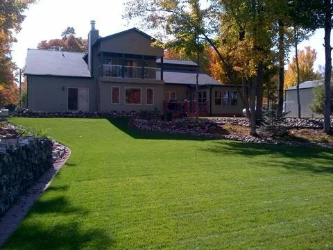 Backyard view highlights the plush yard and lawn...