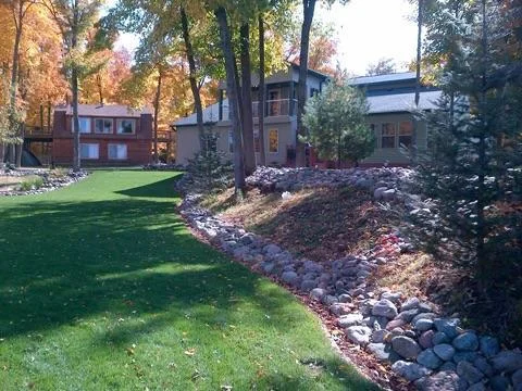This tremendous landscaped yard will really "wow" you - the seller toted in approx. 157 trailer loads of landscape boulder alone...hand picked and hand placed!