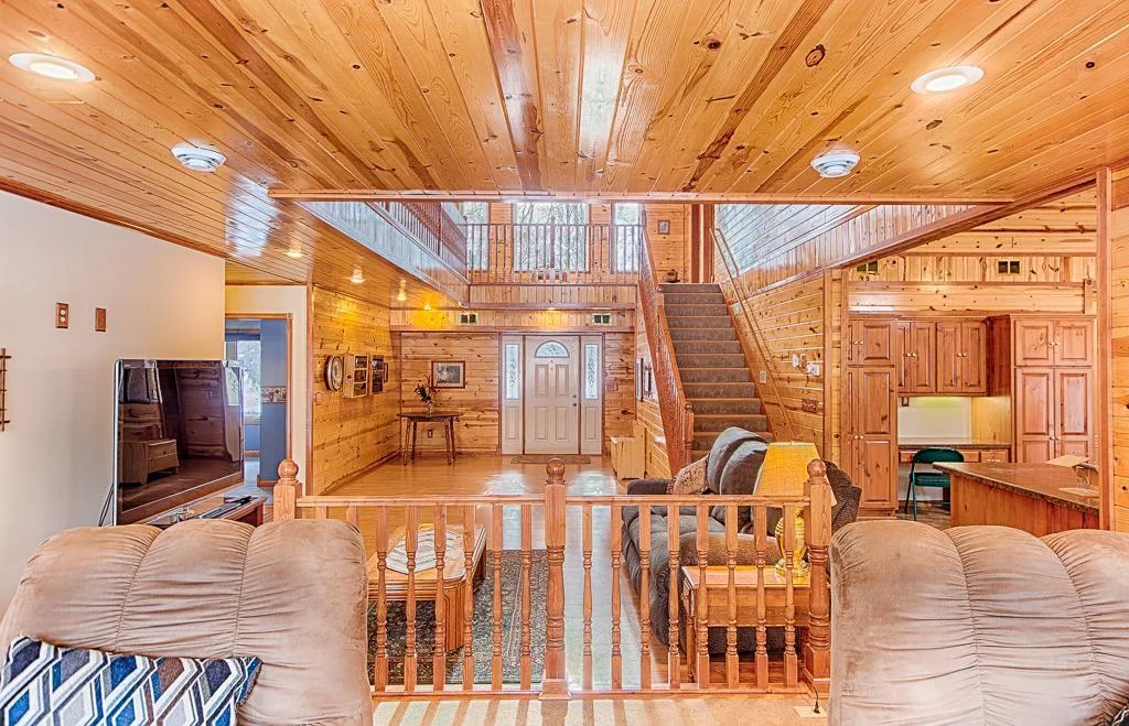 From edge of upper tier living room, looking back toward the front main entry door...