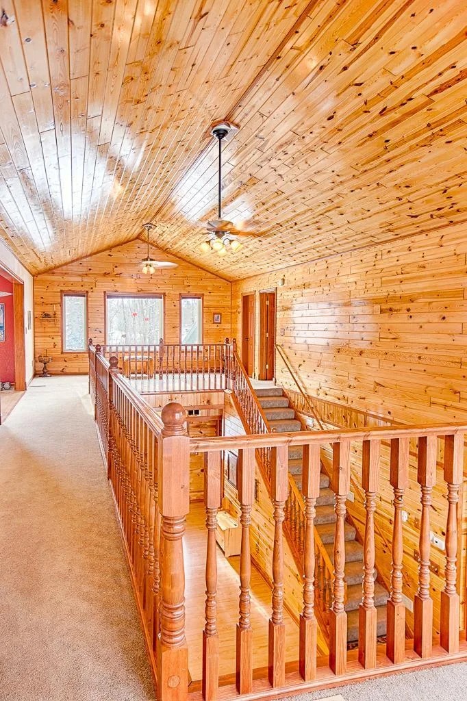 A view of the upper level balcony area with living space at both ends...