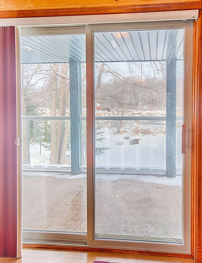 Upper level patio door exits balcony living space to the covered balcony overlooking Borden Creek with views of MilleLacs to your left!