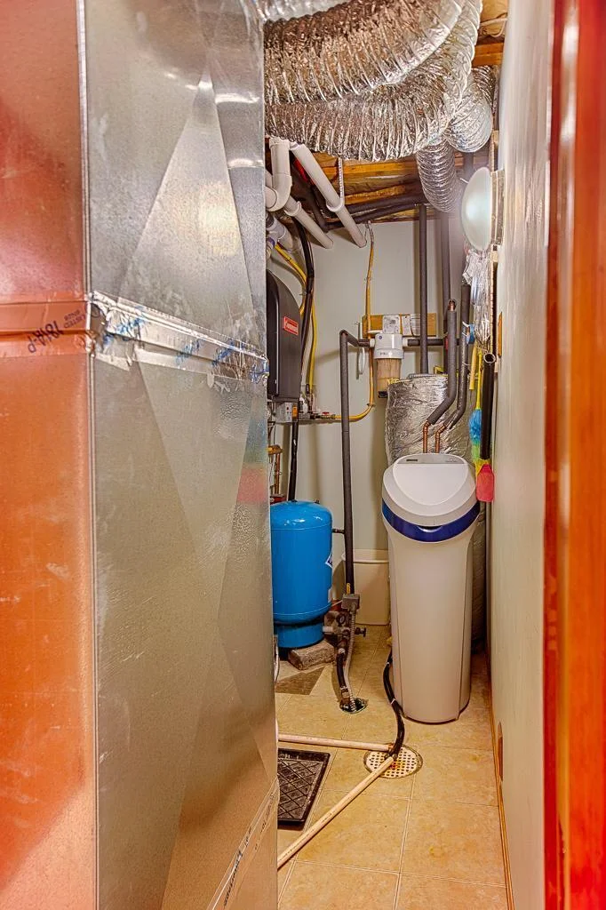 All the utilities are nicely compacted in this main floor utility room.