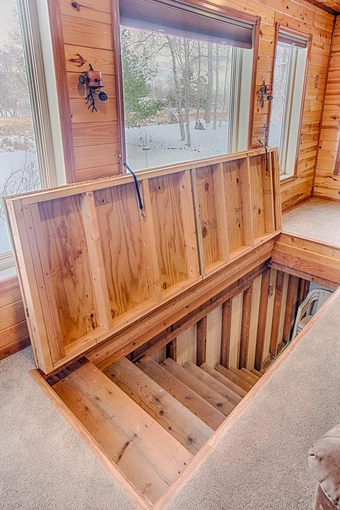 Here is the access to the crawl space/storm shelter and storage area - easy access from creek-side living room area.