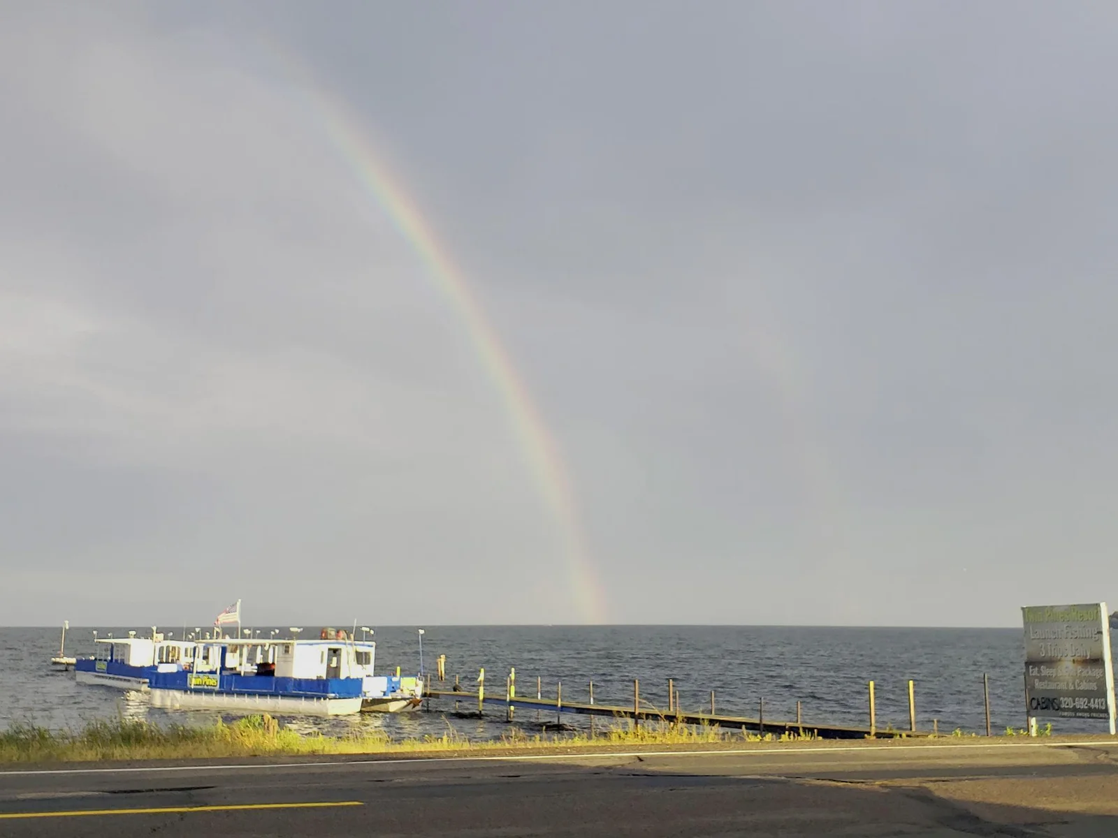 Rainbow over fishing boat.jpg