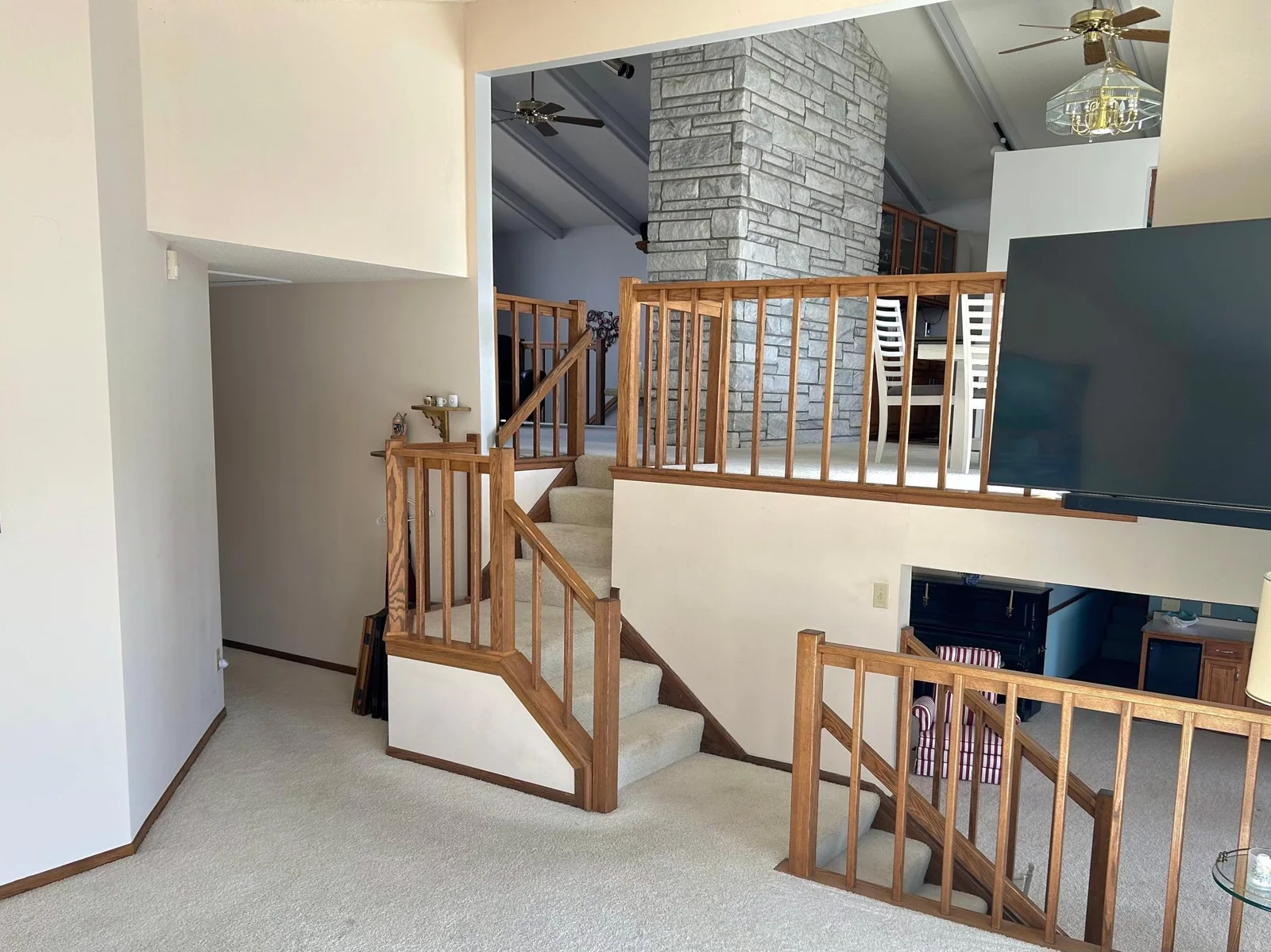 View from main level family room into upper level living/dining and lower level walk out!
