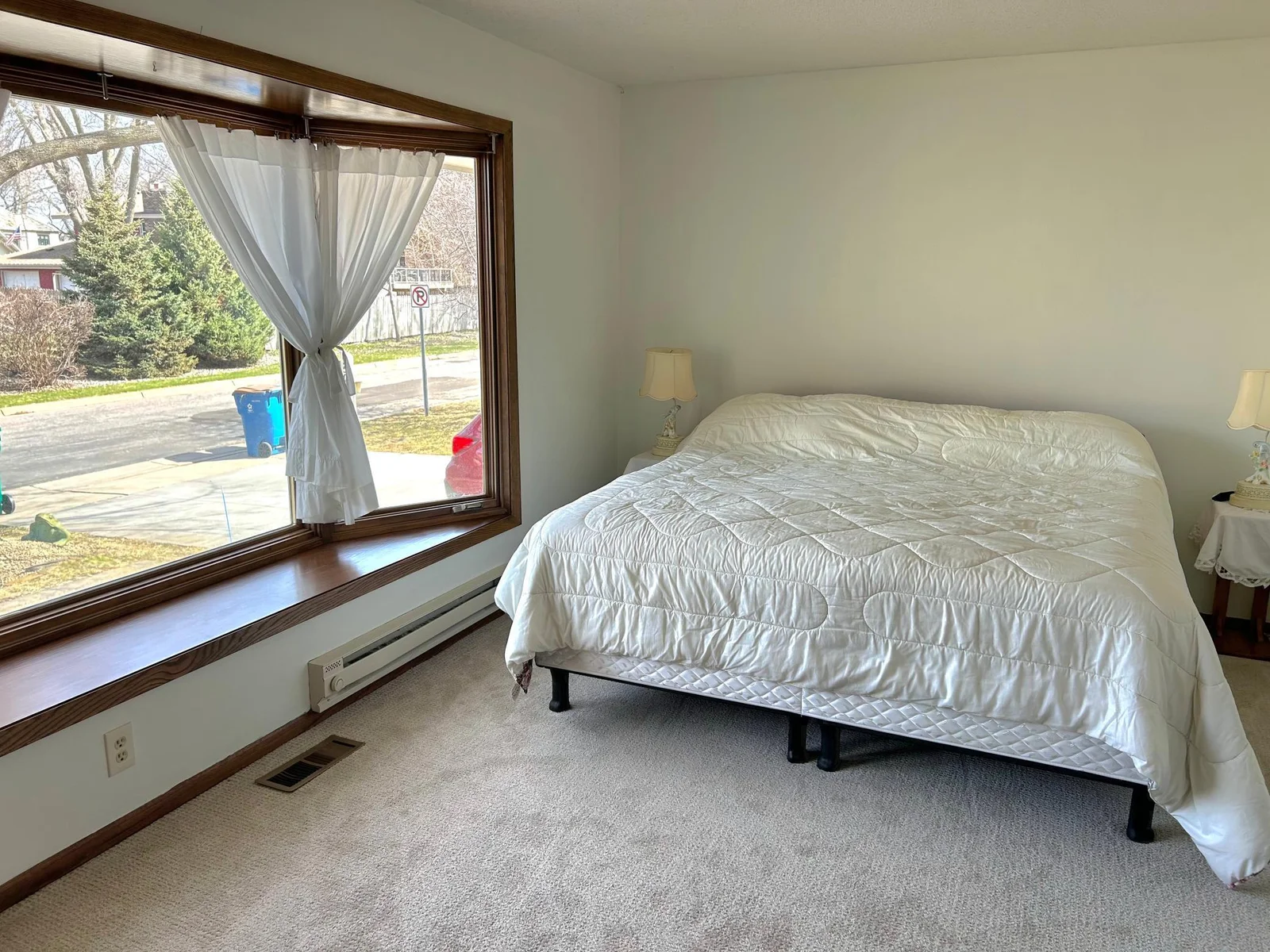 Main level Bedroom #2 with bay window adding depth and light!