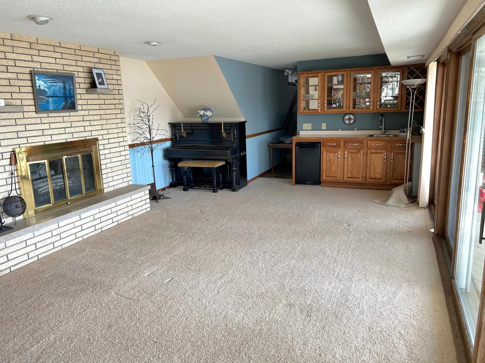Lower level features a wood burning fireplace and mini bar!