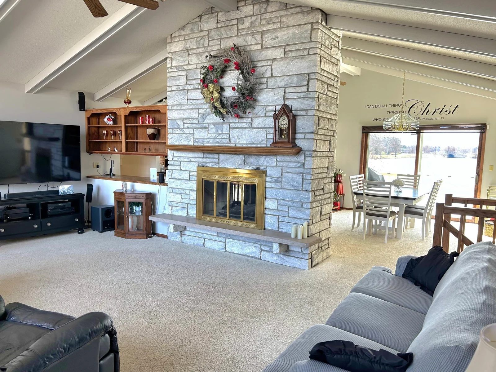 Living Room has gas-burning fireplace and open floor plan with views of the lake!