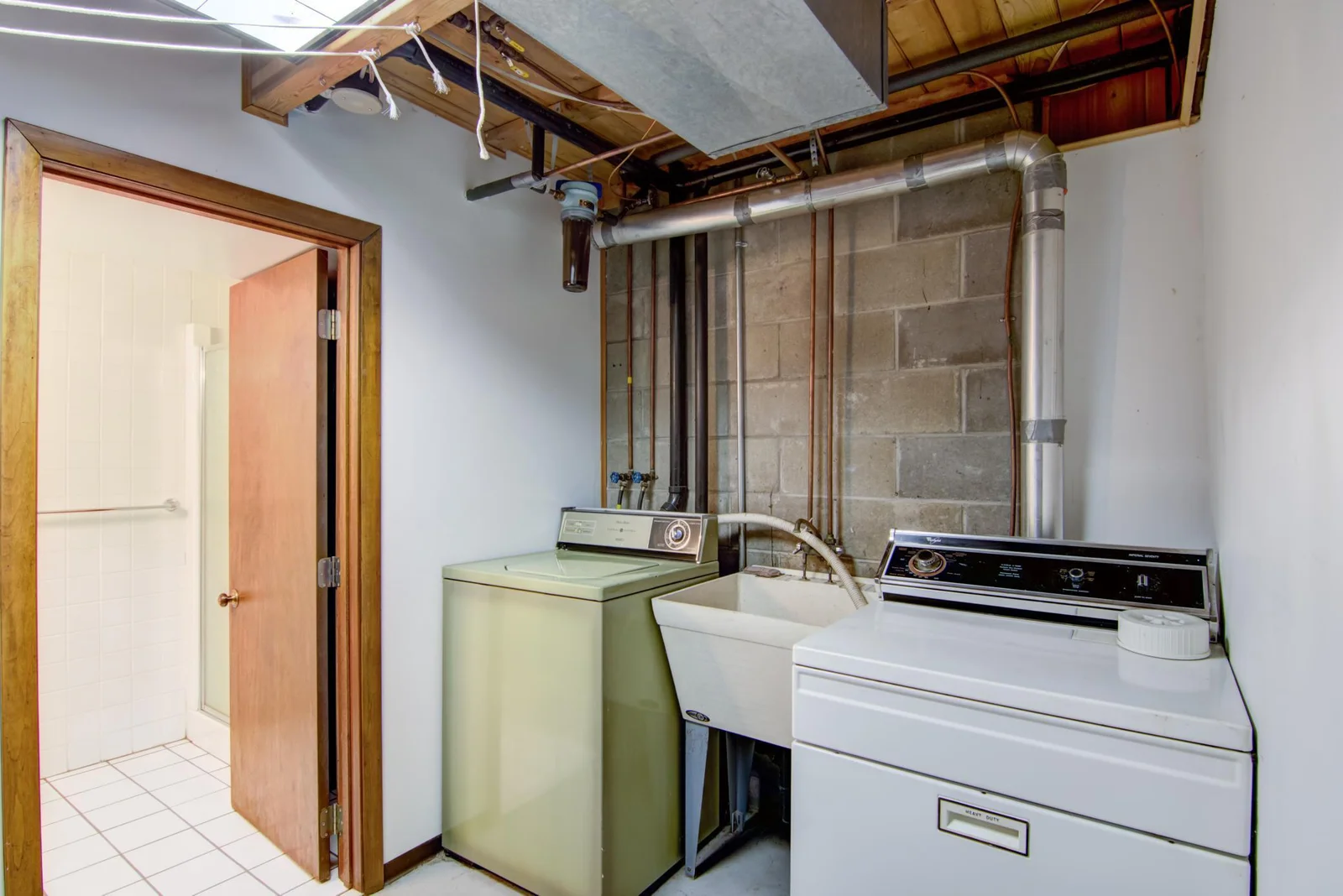 Laundry in basement next to the bathroom.