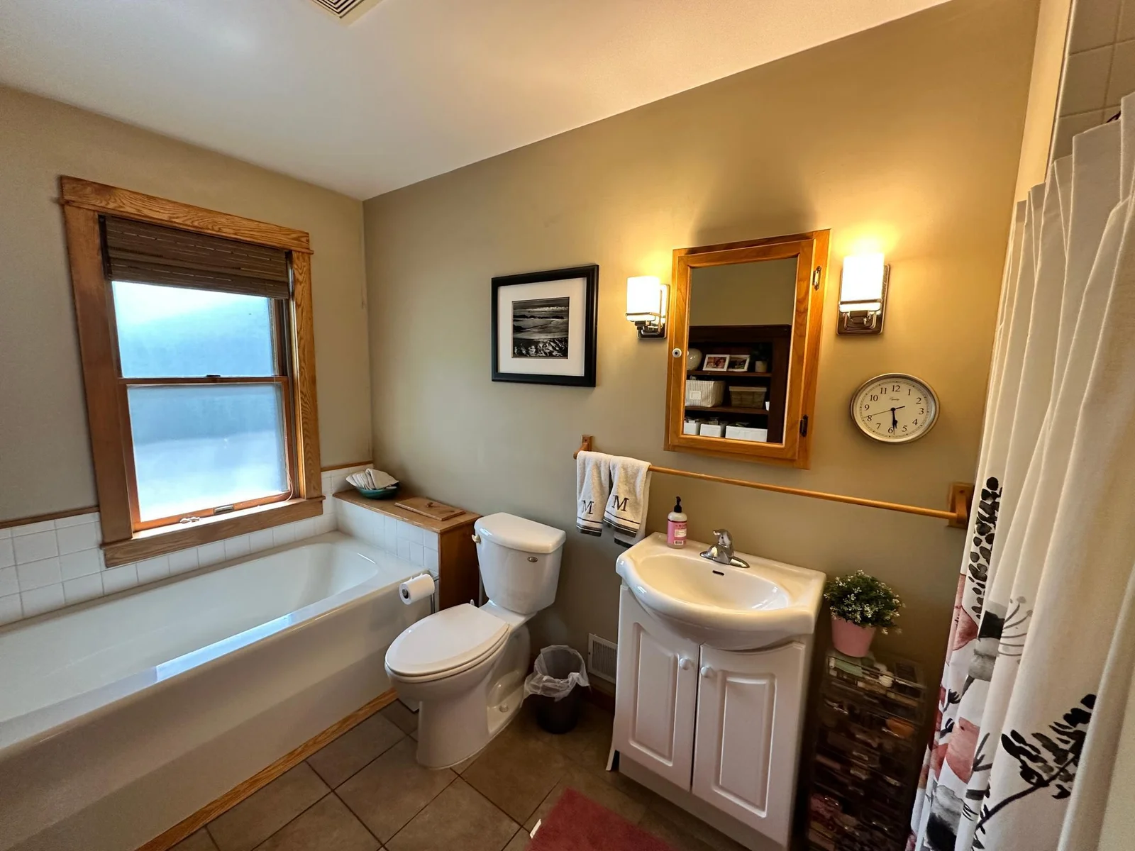 Main floor bathroom features a separate tub and shower