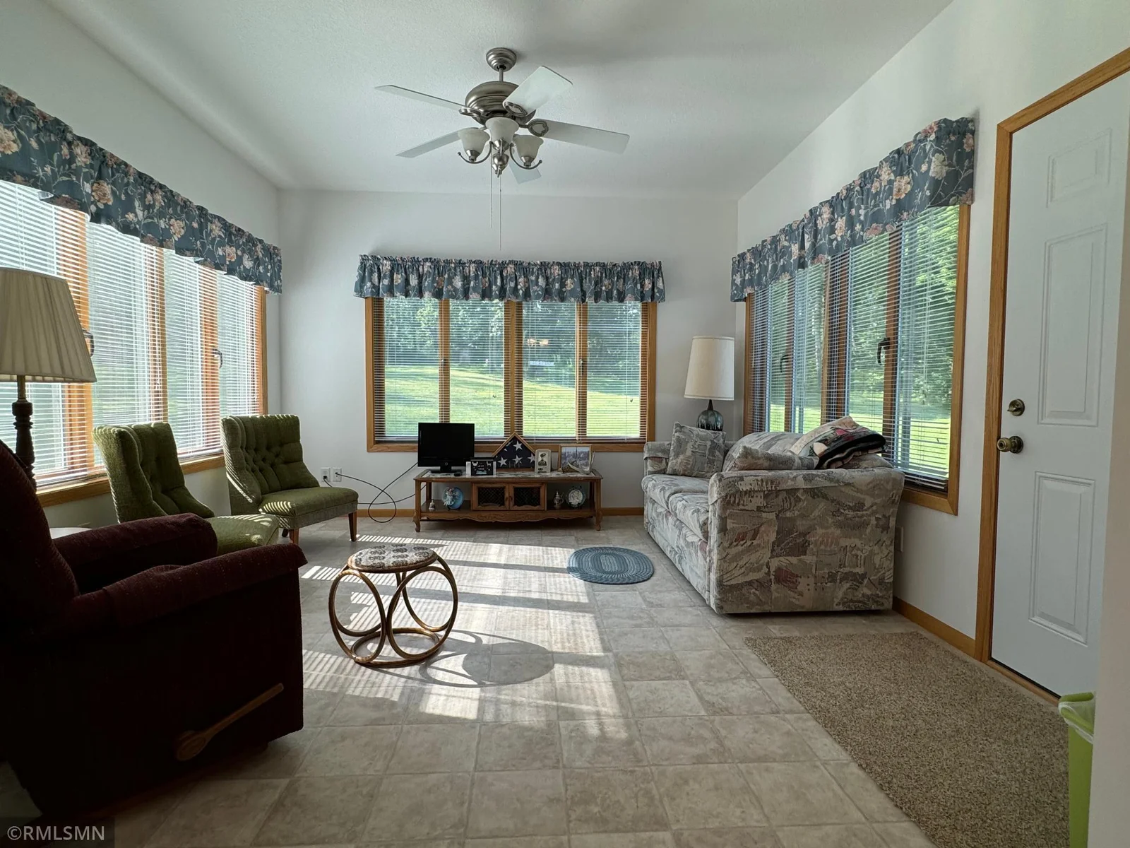 Family room is really more like a Sunroom wiht all the windows and picturesque views.