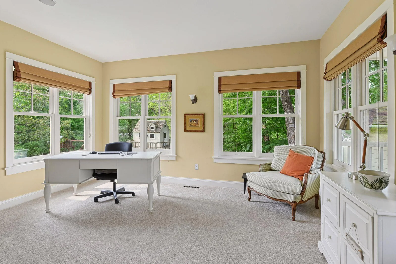 Main floor office surrounded by windows and abundance of natural light