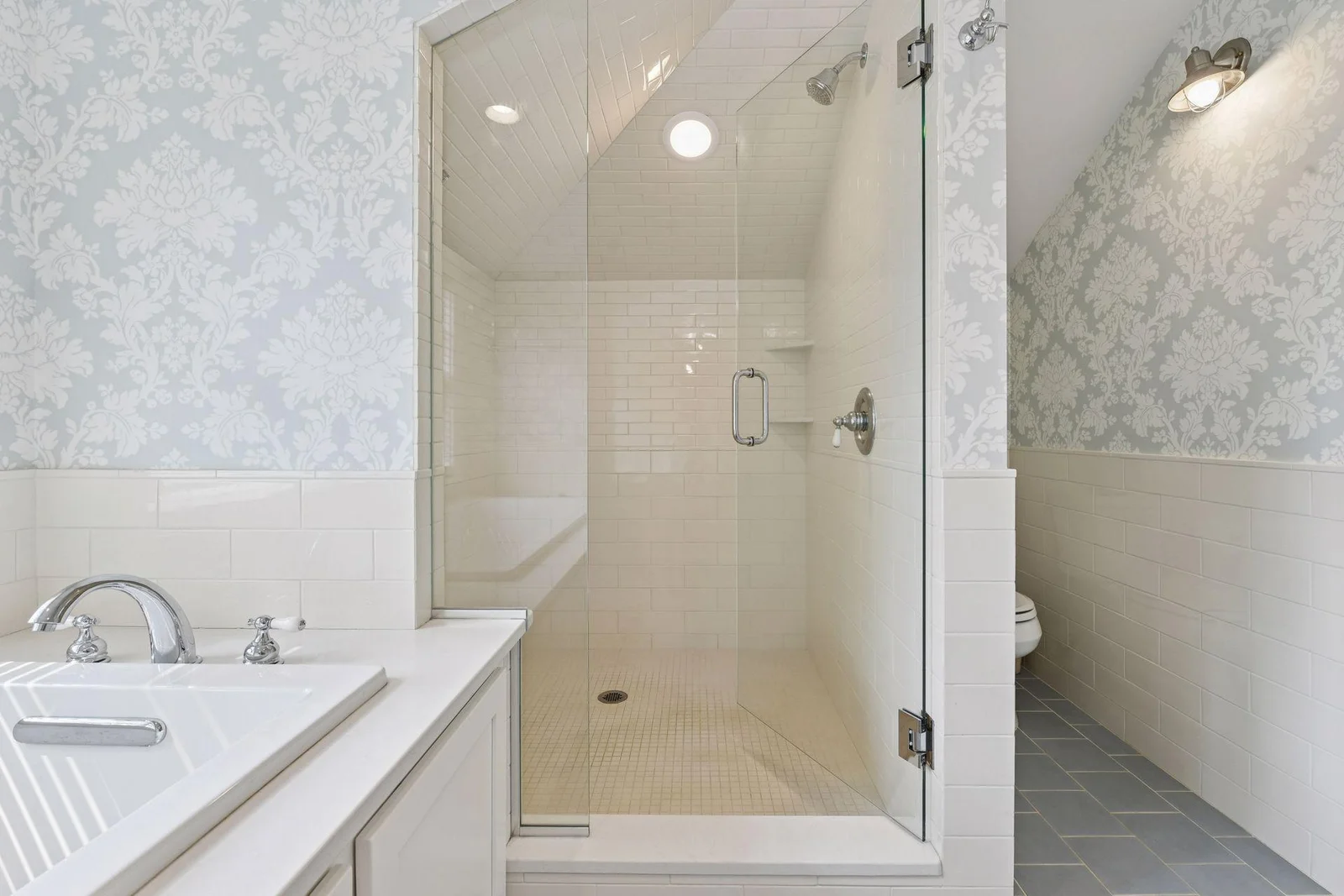 Spacious primary ensuite bathroom with large tiled walk in shower