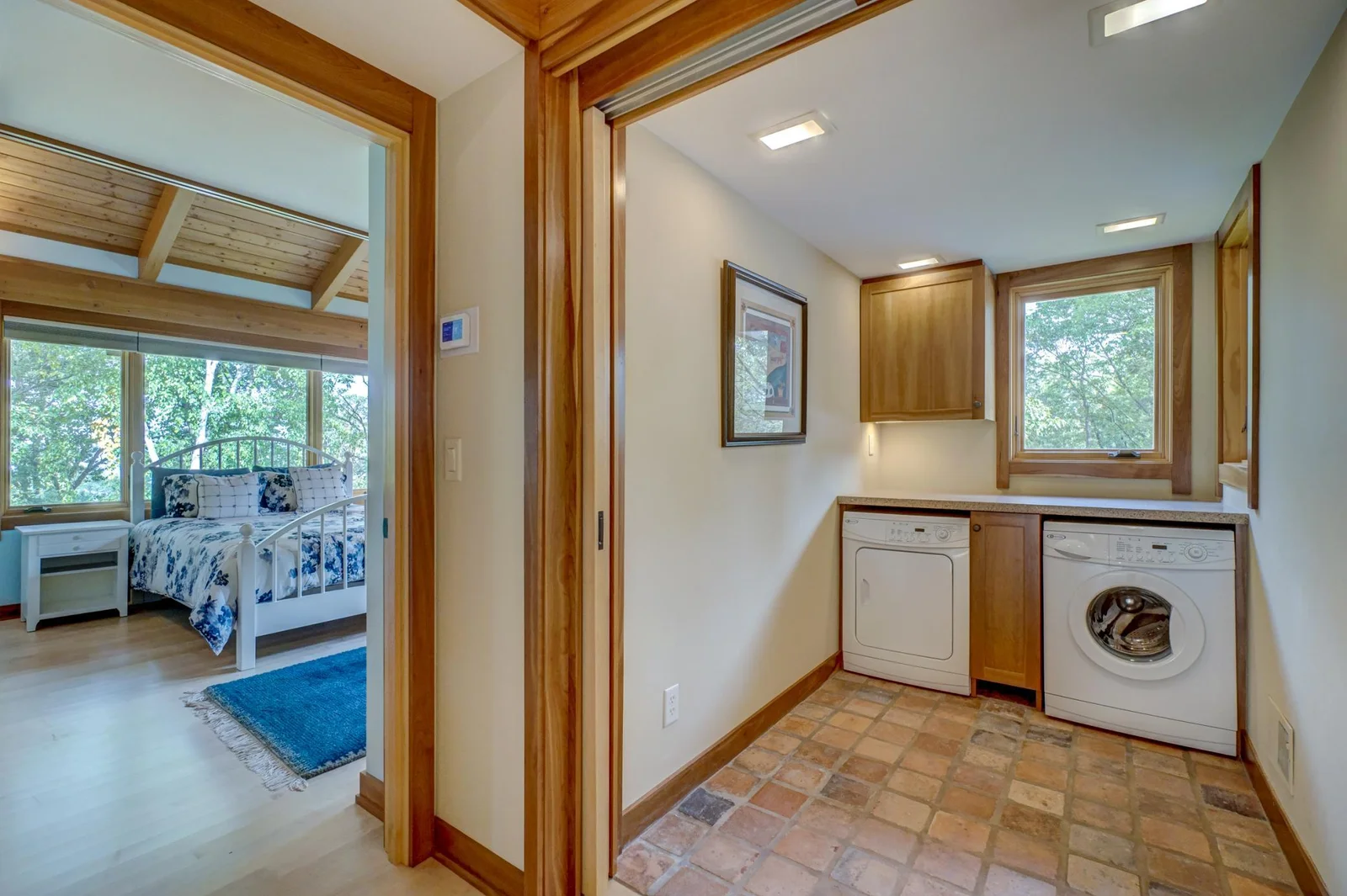 Secondary bedroom and one of two laundry rooms