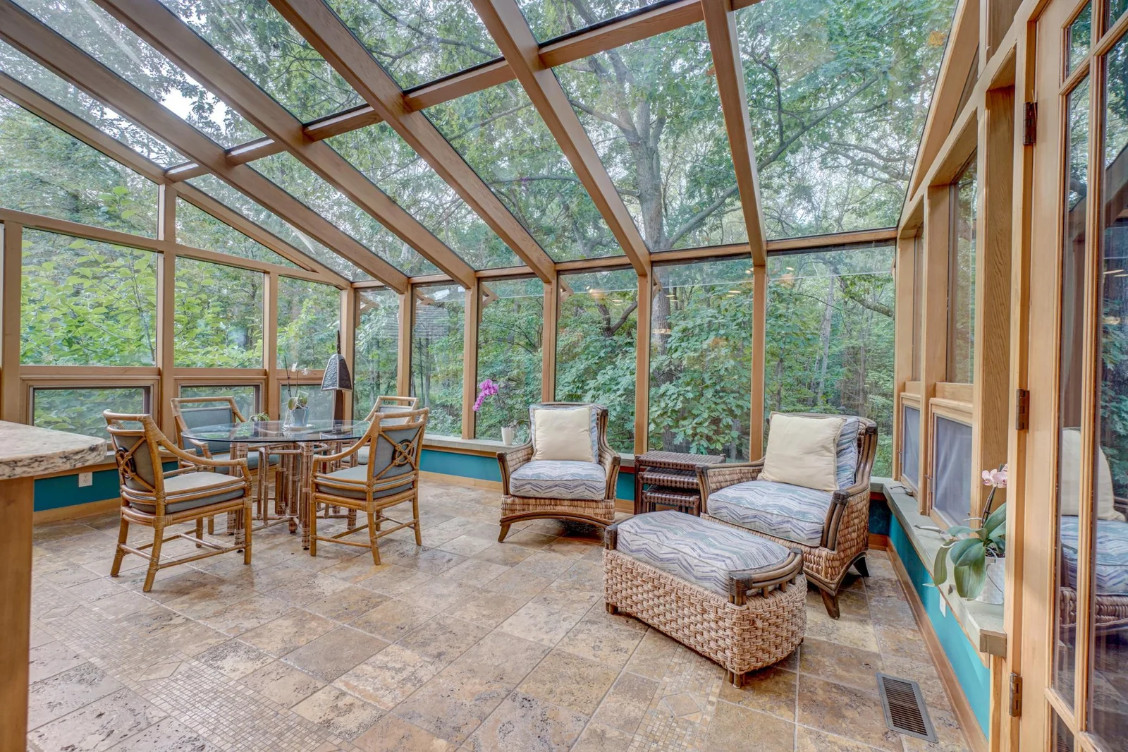 Off the kitchen is a great sun room perfect for taking in the four seasons