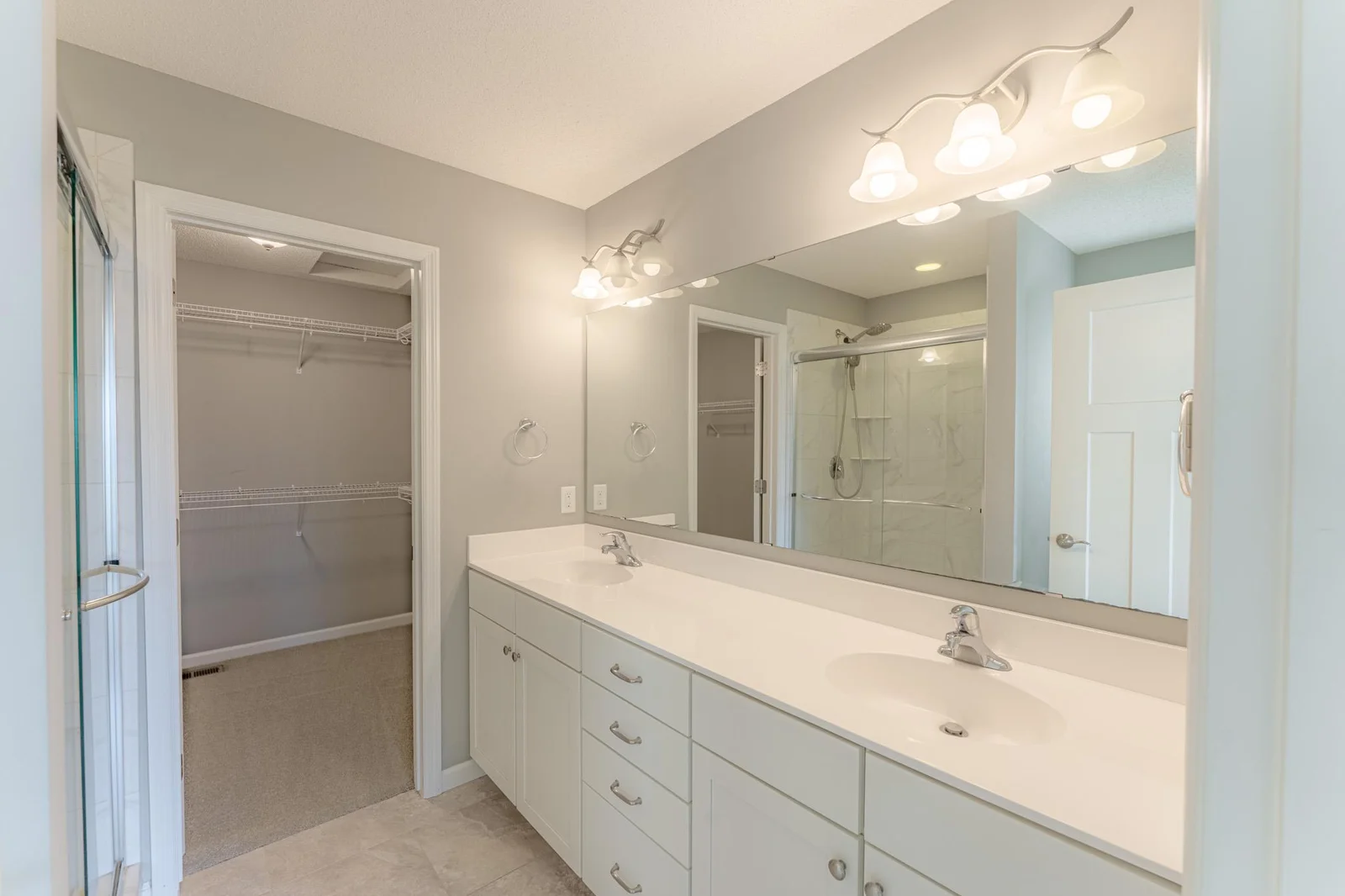 Cozy primary bath offering functional fixtures and generous space.