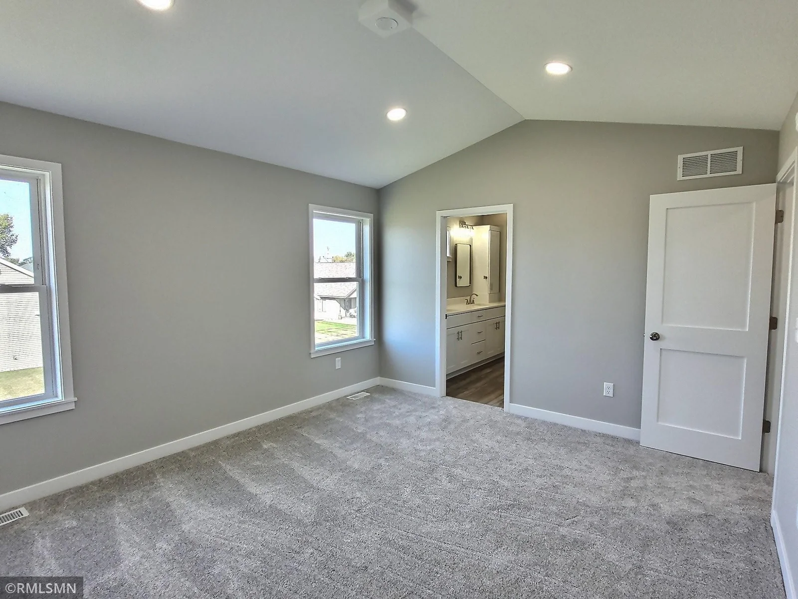 The owners suite will be lakeside and includes dual sinks, tile shower and spacious walk in closet. Photo is from builders model home and this is what will be built on the lot.