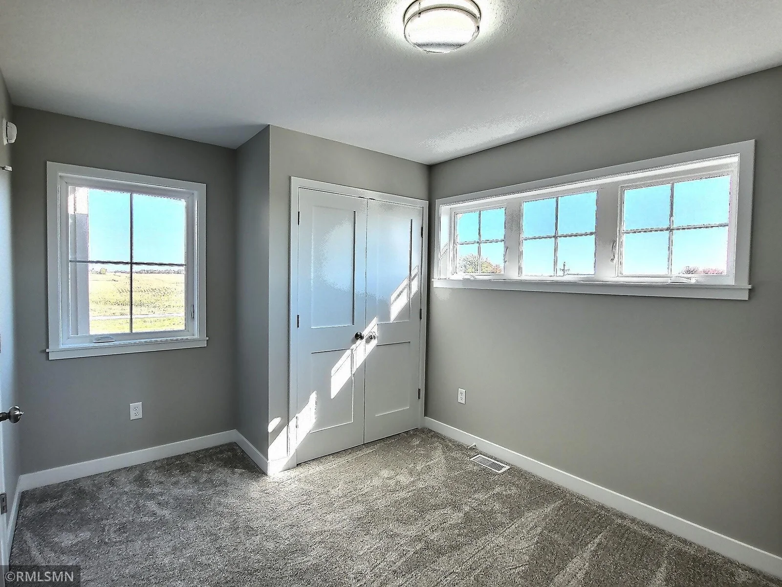 Here is the one of the bedrooms on the upper level or use as your home office. Photo is from builders model home and this is what will be built on the lot.