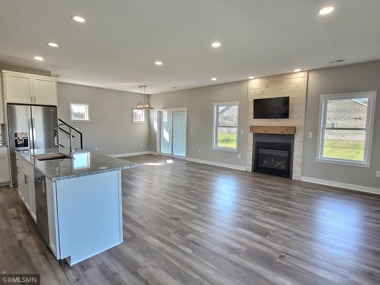 The new home will offer great views of the water from the interior of the home. Cozy up in front of the fireplace and capture the natural beauty on the outside. Photo is from builders model home and this is what will be built on the lot.