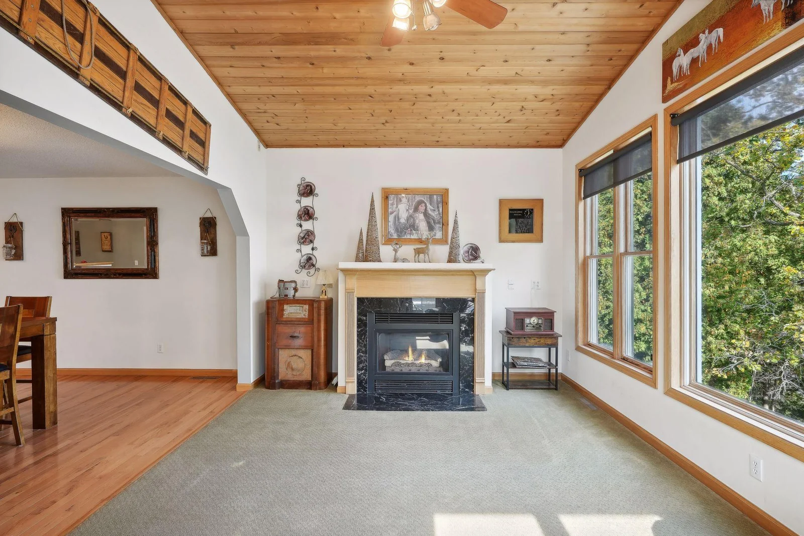 Family room area offers vaulted ceilings, gas FP, and amazing views of the lake.