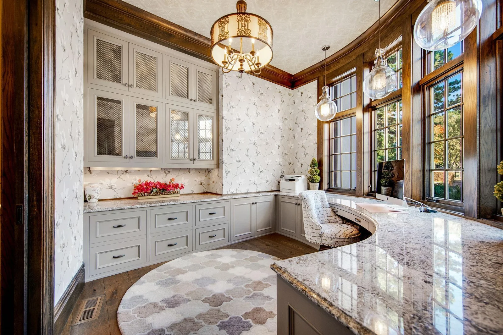 Adjacent to the kitchen is also the main floor office. Each room has been carefully designed to accent the new lighting and wall paper.
