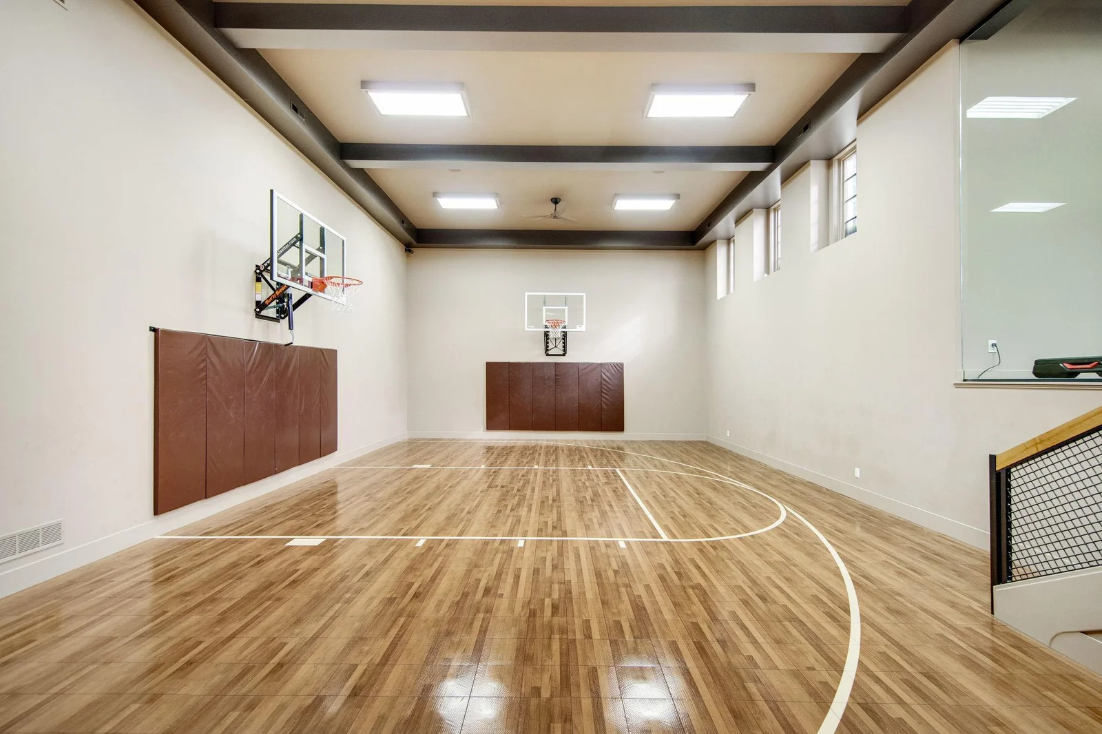 Equipped with basketball hoops, it’s perfect for practice or friendly games, allowing for year-round play regardless of the weather.