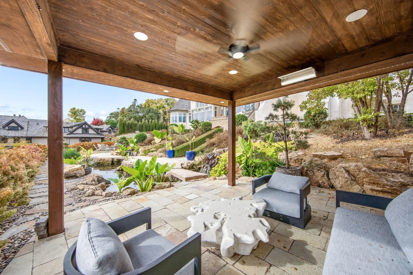 The outdoor covered patio is quipped with ceiling fans, heaters, and misting sprays. All overlooking the beautifully landscaped yard.