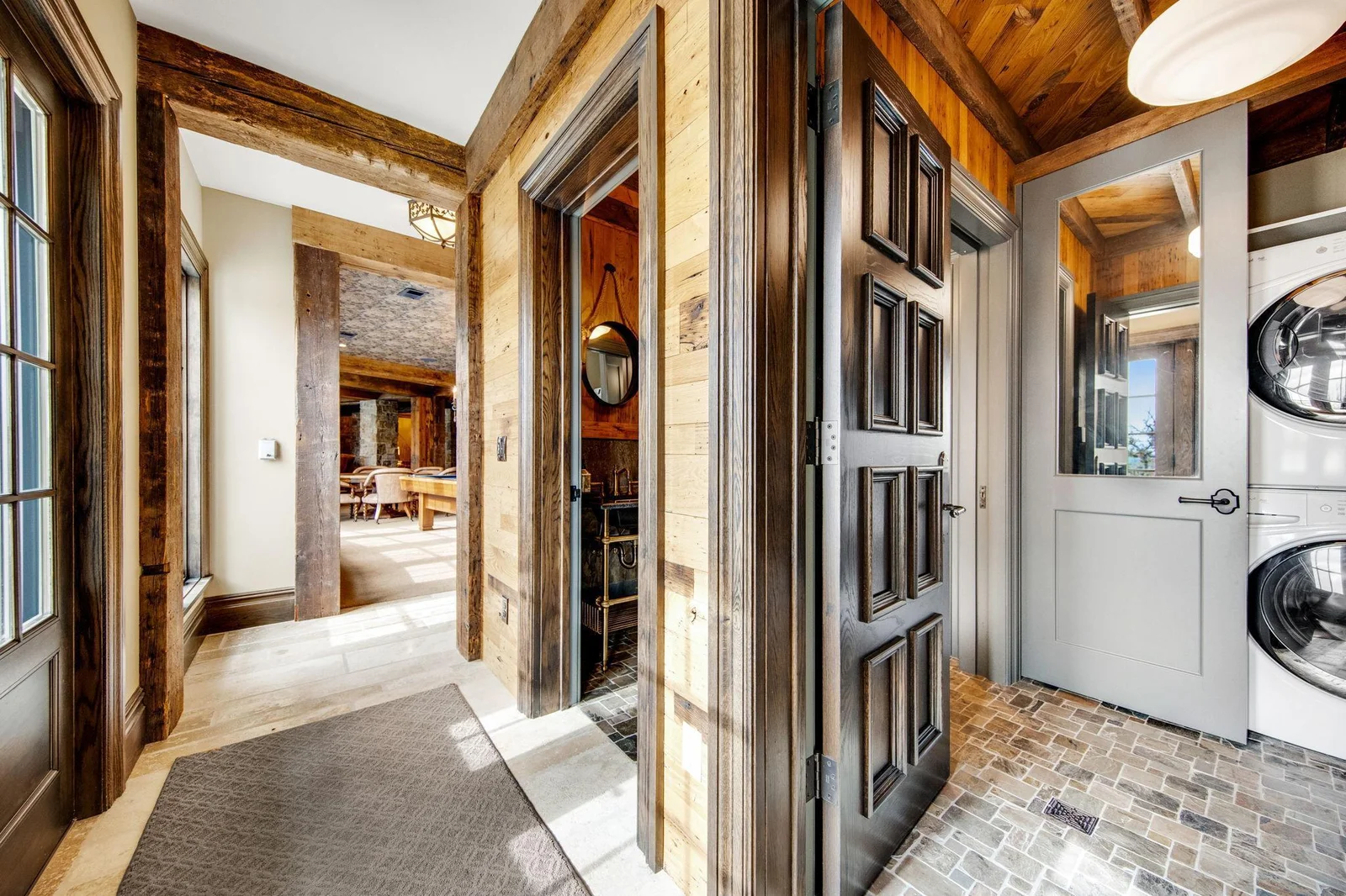 You'll also find a convenient laundry room, thoughtfully located for easy access after a day of swimming or outdoor activities.