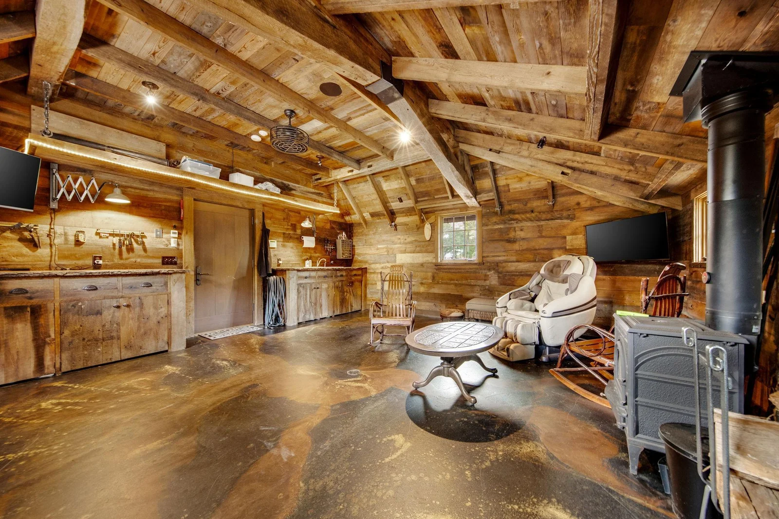 Transforming one of the garages into a man cave is a fantastic idea, creating a personalized retreat for relaxation and entertainment.