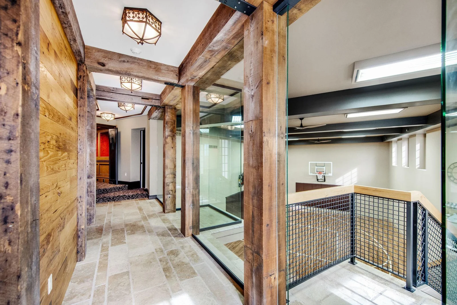 Hallway leading to the sport court, gym, and theater room.
