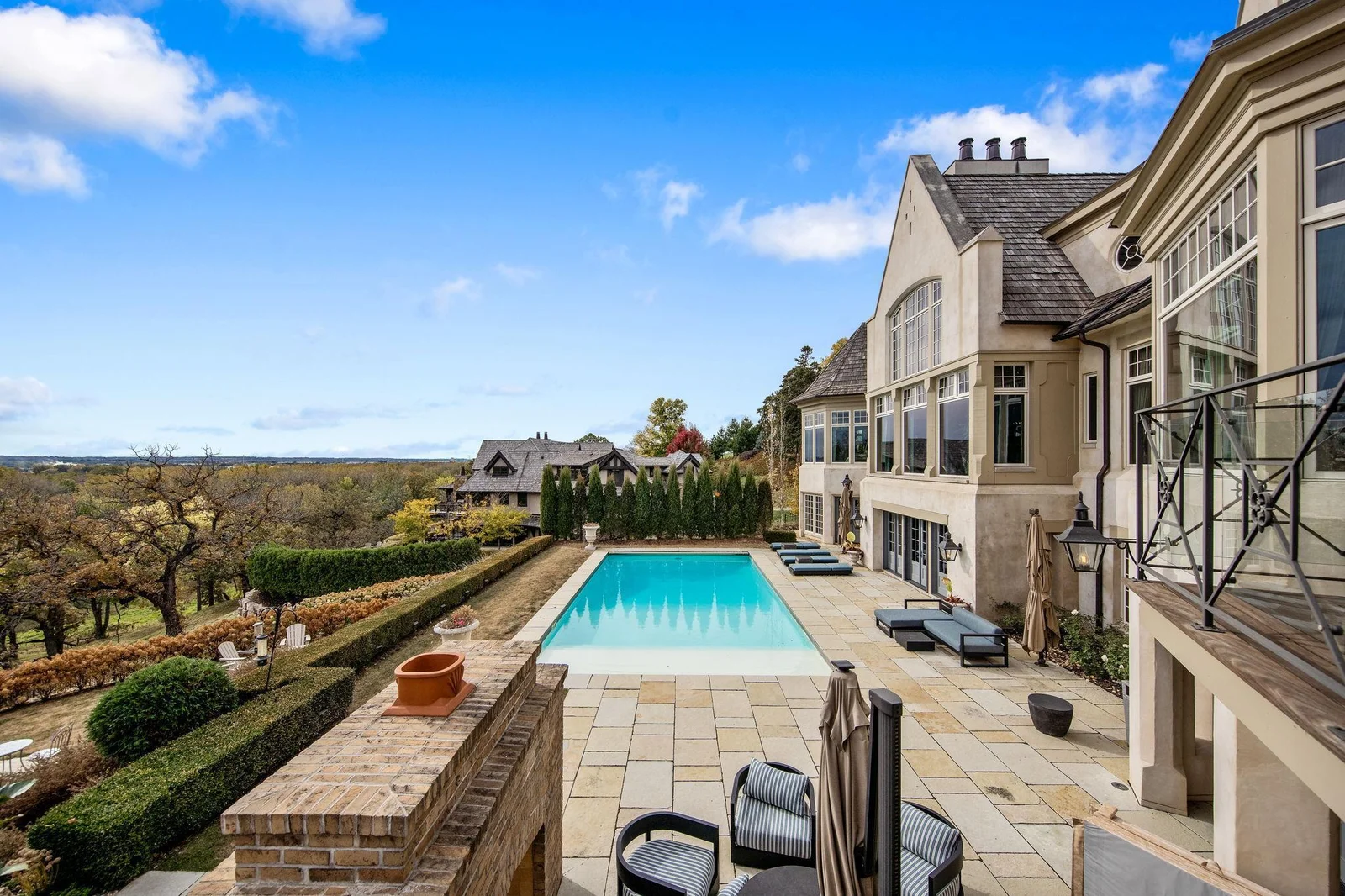 The pool deck is a stunning outdoor oasis, featuring a beautifully designed paver patio that enhances the space’s elegance and functionality. At the heart of the patio is an underground heated pool.