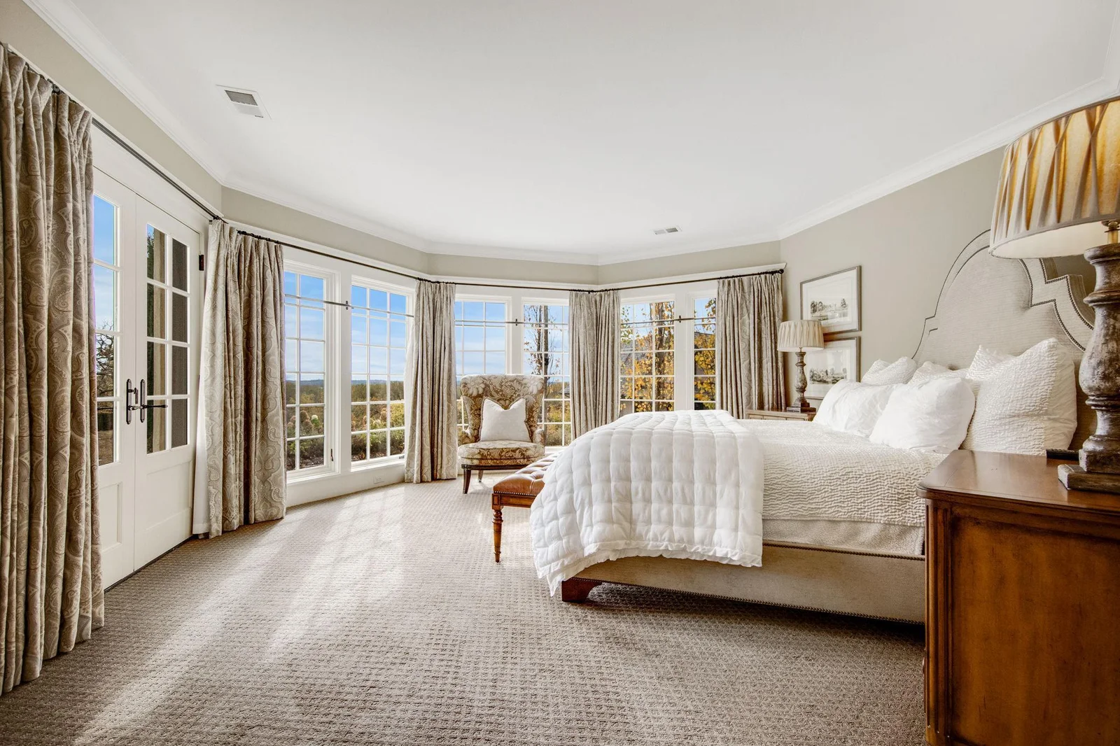 The lower-level bedroom retreat is a serene escape. Patio doors open directly to the pool deck, allowing for easy access to outdoor relaxation and entertaining. The seamless transition from the bedroom to the pool area enhances the overall appeal.