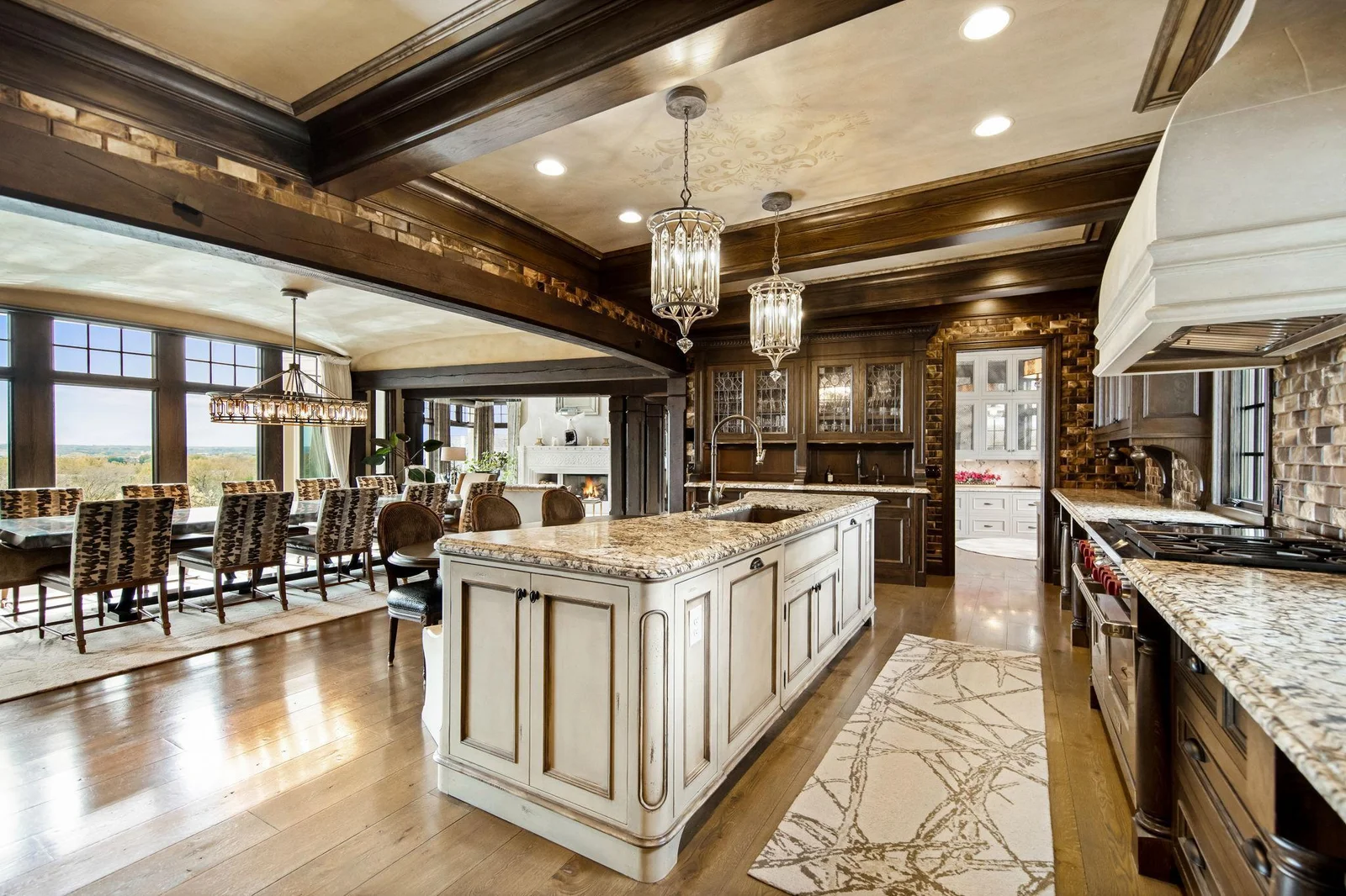 With not one, but two dishwashers, entertaining is effortless and cleanup a breeze. Stylish wine racks provide the perfect showcase for your collection. This space is not just a kitchen; it’s a gourmet experience waiting to happen.