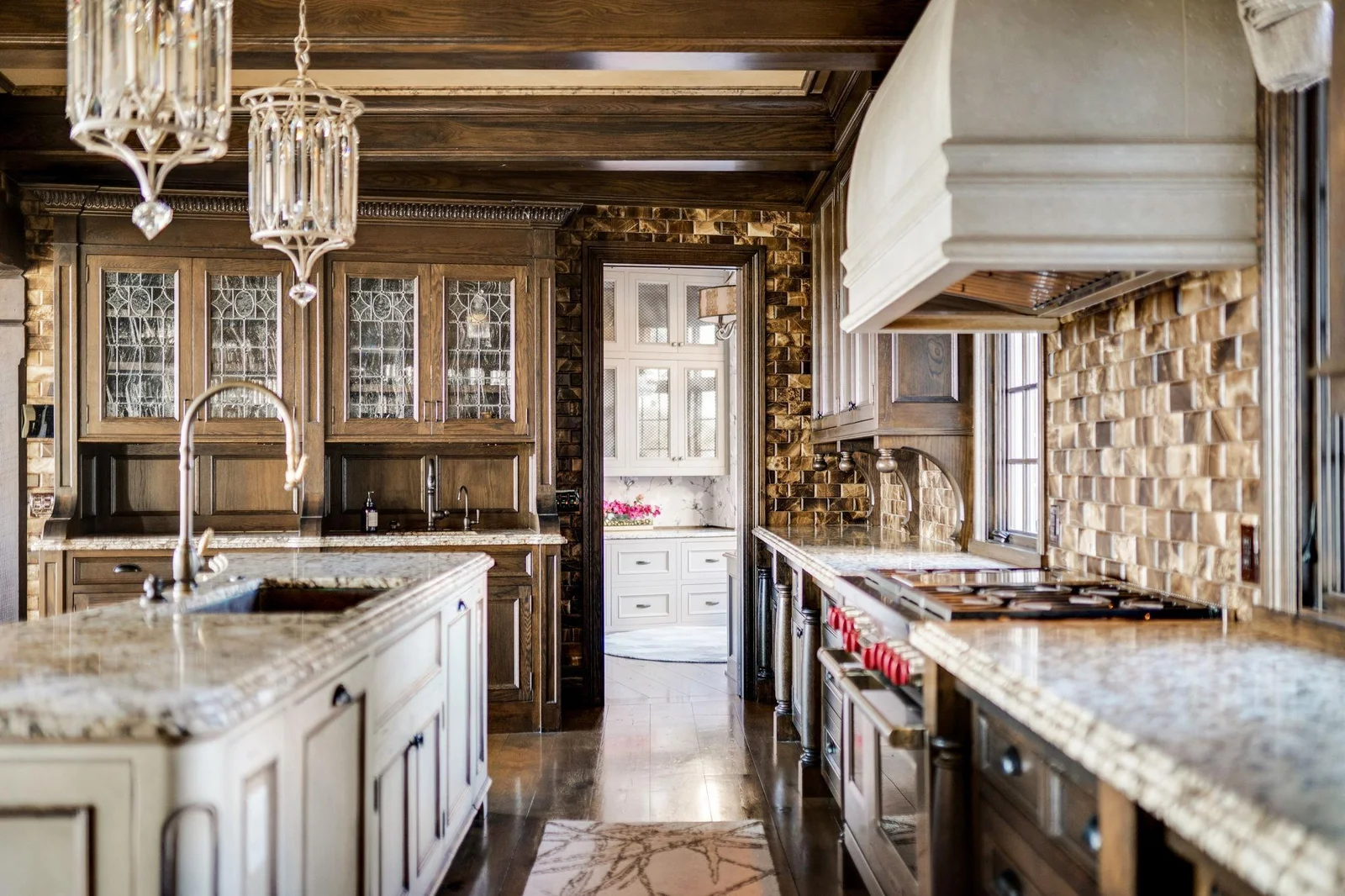 The custom features are endless! Pull outs on each side of the island, soft close drawers, 2 sinks, and under cabinet lighting.