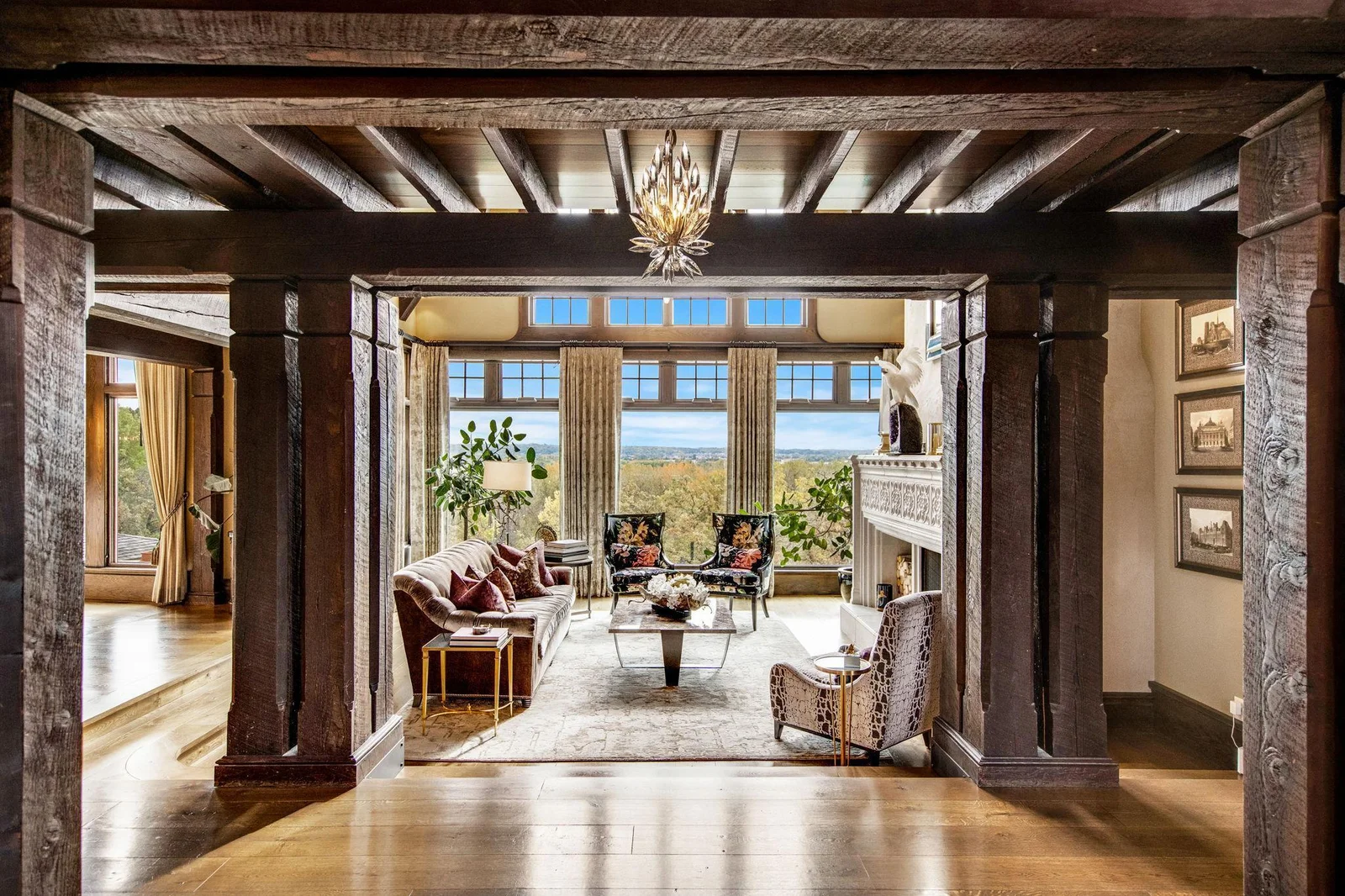 As you step inside, you’re greeted by the warmth of exposed wood beams overhead, adding character and depth to the spacious interior. Rustic elegance bringing the outside in.