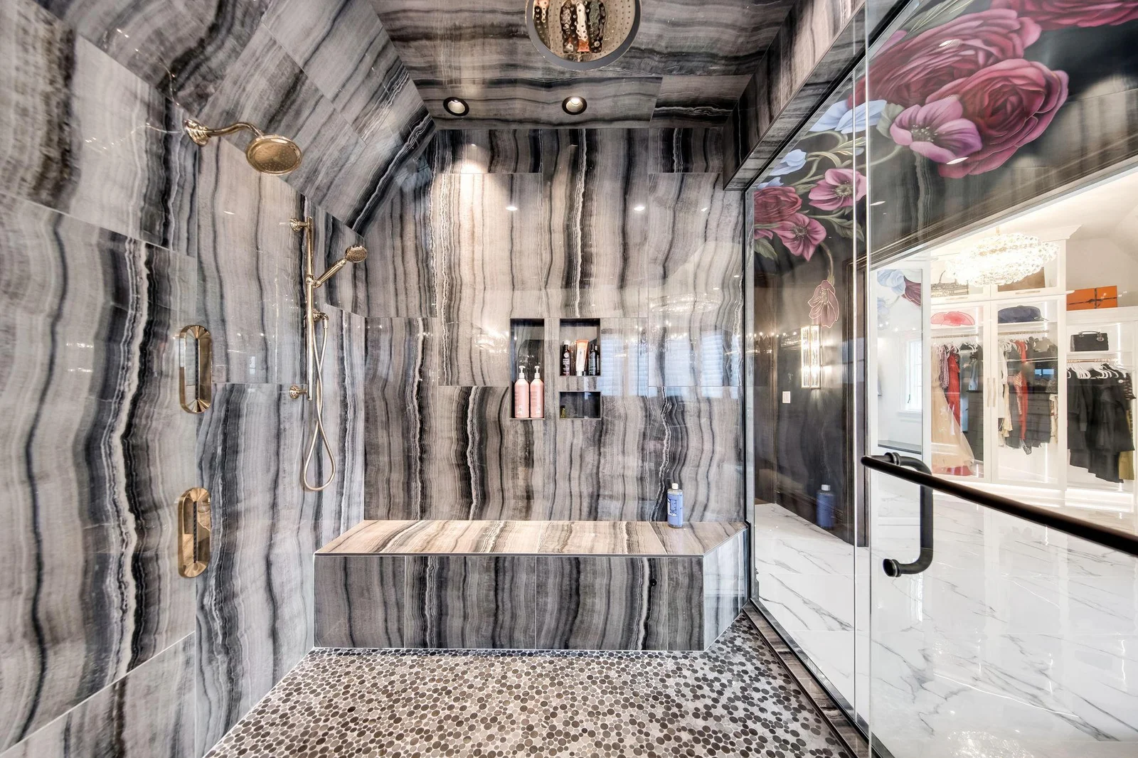 Enclosed in sleek glass, the huge walk-in steam shower is a true highlight of the bathroom, designed to transform your daily routine into a spa-like experience.