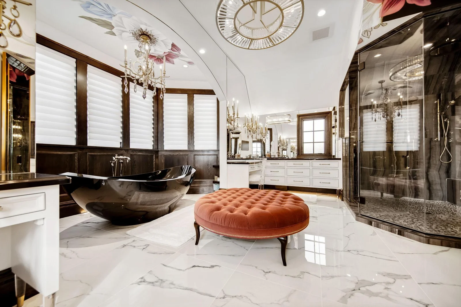 As you move into the bathroom, you're greeted by opulent finishes—a spacious soaking tub, a walk-in steam shower, and dual vanities.