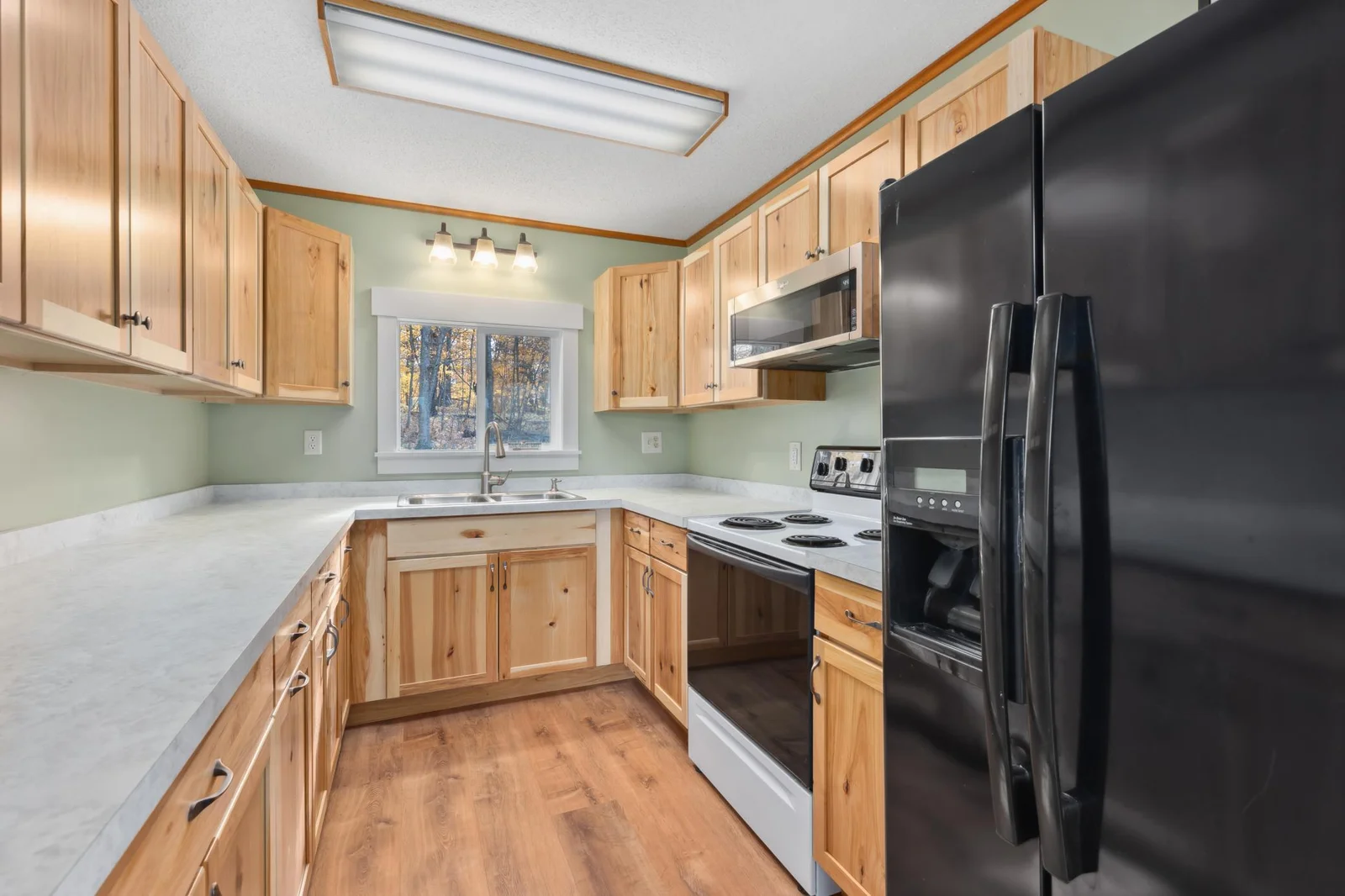 Updated kitchen with great storage and counter workspace. Imagine cabin mornings with pancakes!
