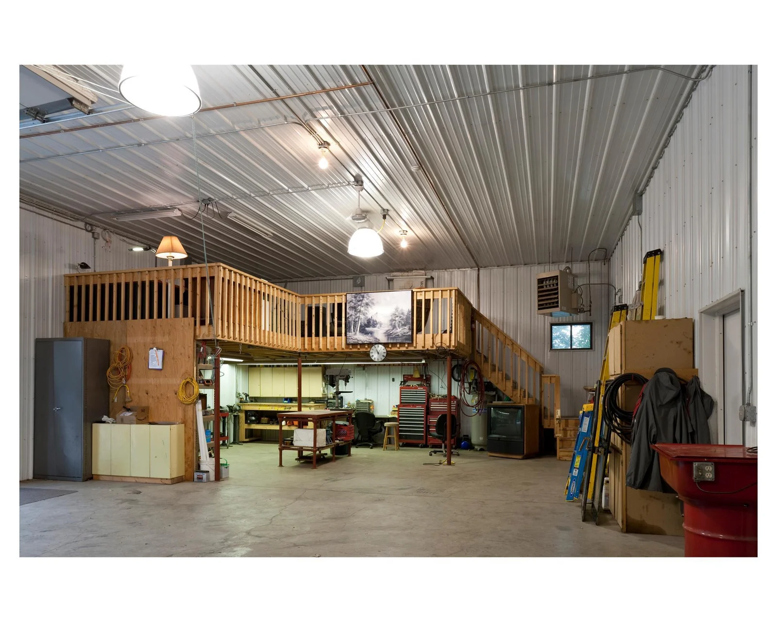 Fully heated workshop in the pole barn with floor drain makes for easy maintenance on all your toys