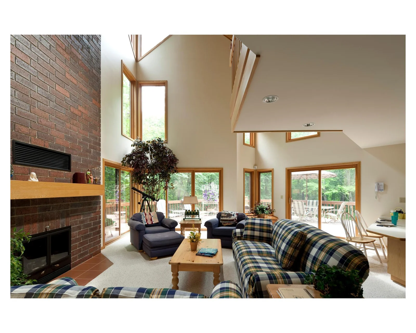 The St Anne house has lots of family space with a main level all-glass sitting area, main level formal living room with vaulted ceilings