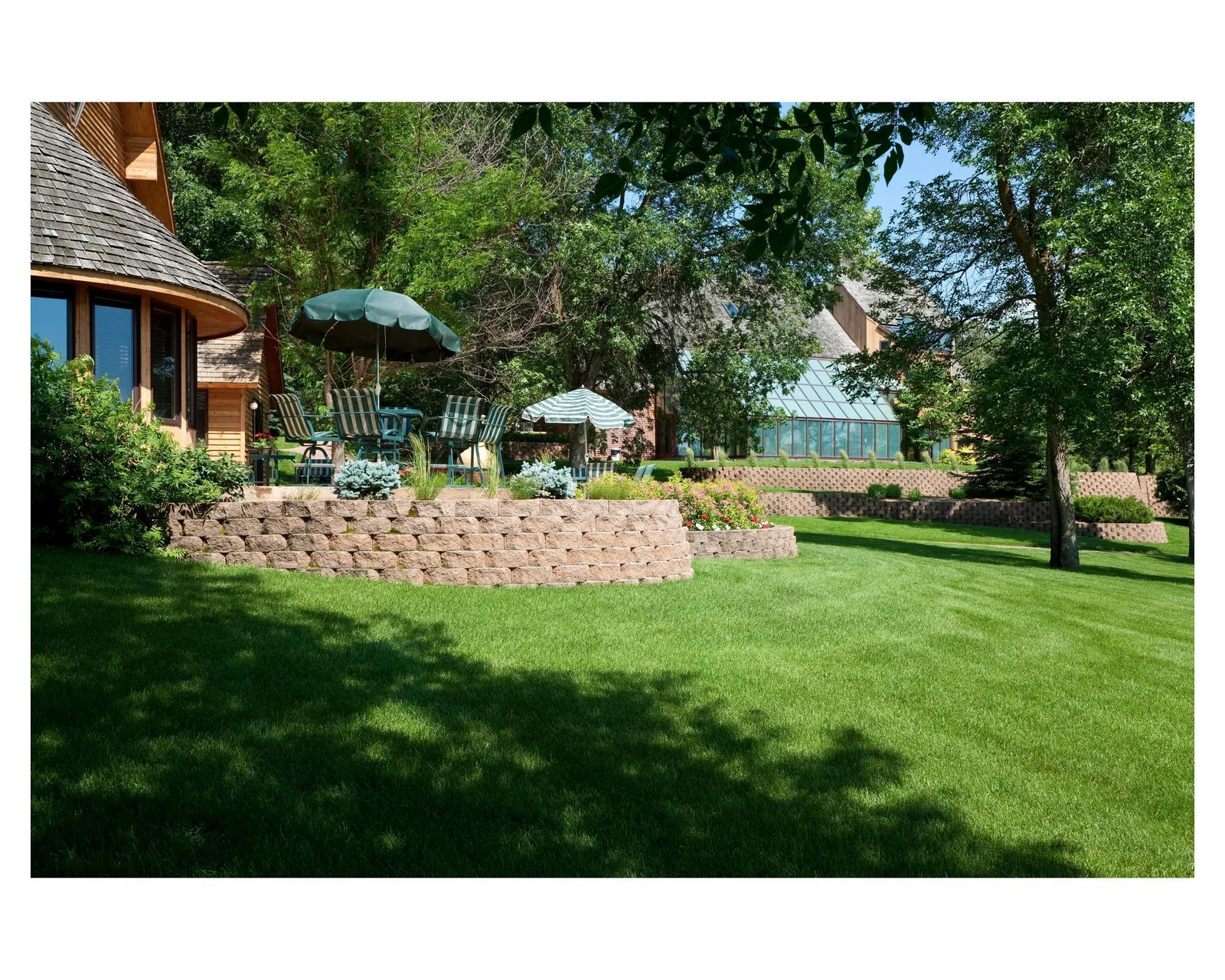 Lush green grass with professional landscaping throughout