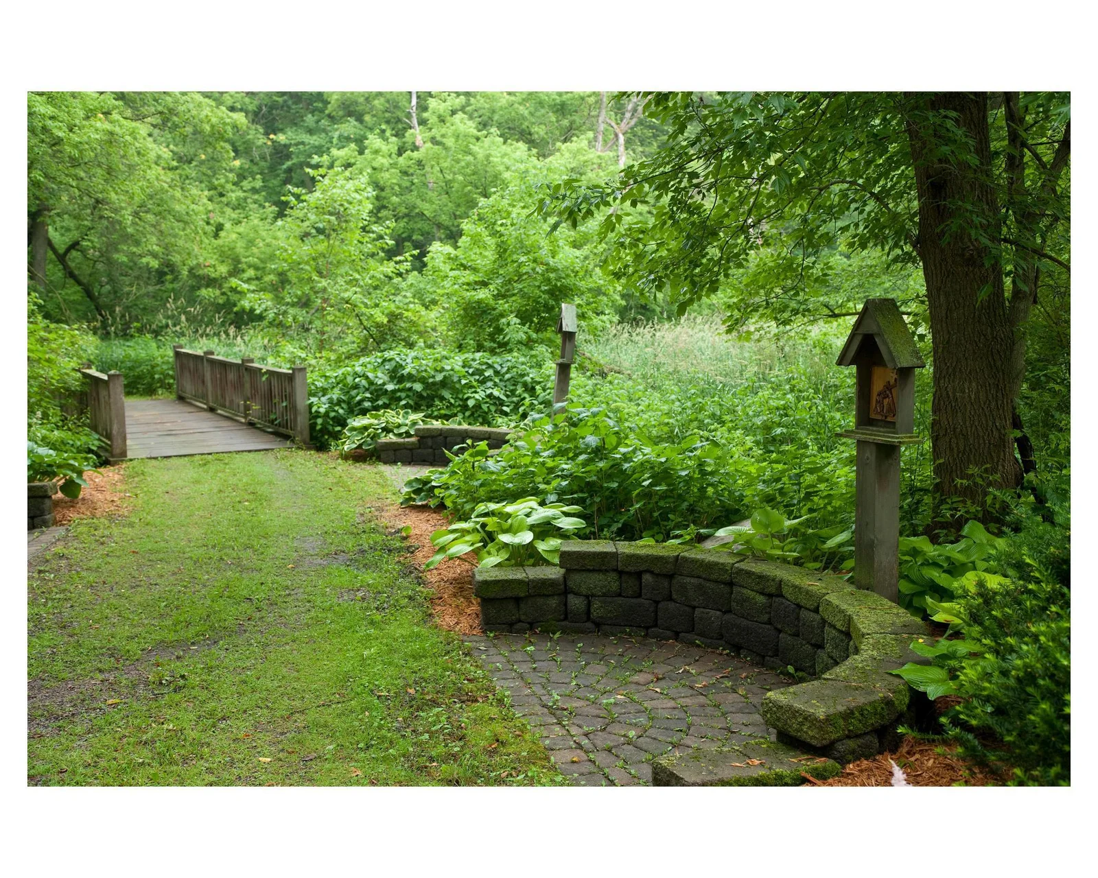 Stations of the Cross with bridge going over the flowing creek